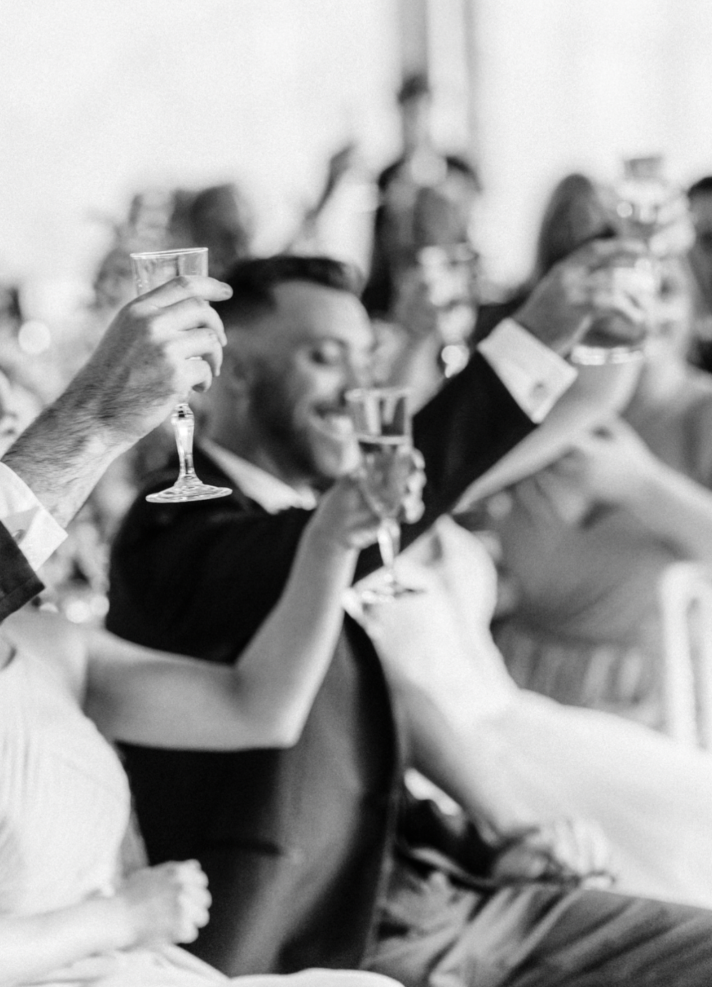 Candid wedding photography, toast reactions at Peterloon tented reception