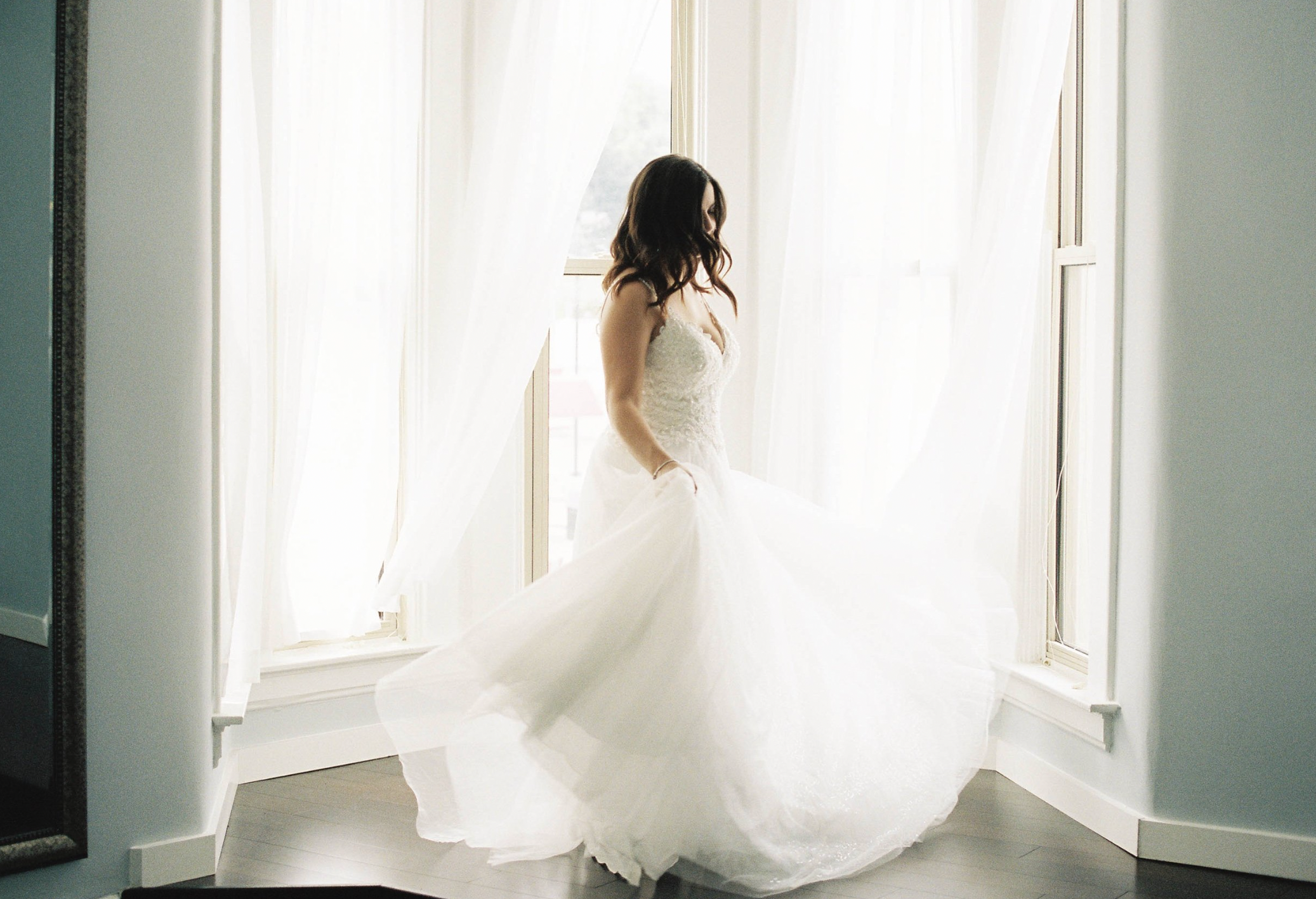 Film photography, bride twirling in dress