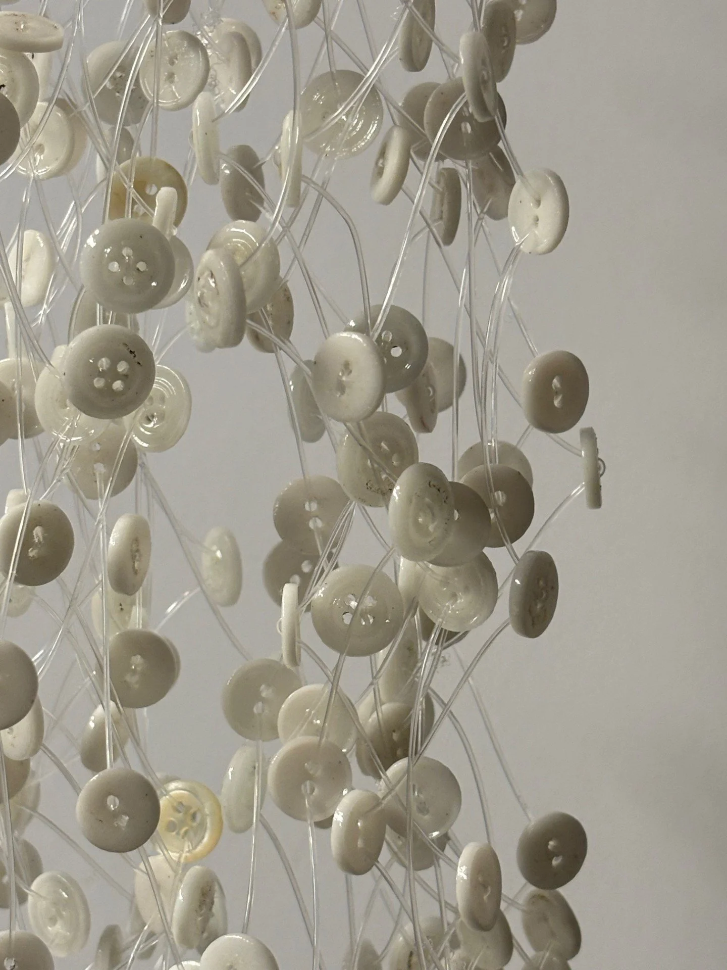 You and Me, close up
2025
Buttons, fishing line, mixed media
40" x 4" x 4"