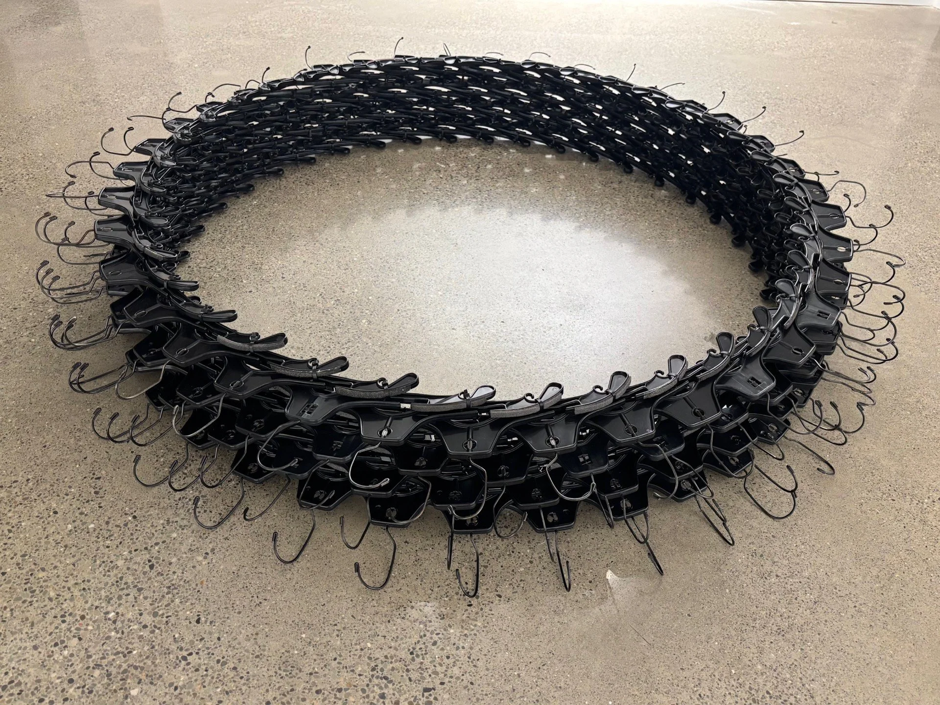 Circle of Life, display variation
2025
Hangers, cable ties, mixed media 
6' x 6' x 10"