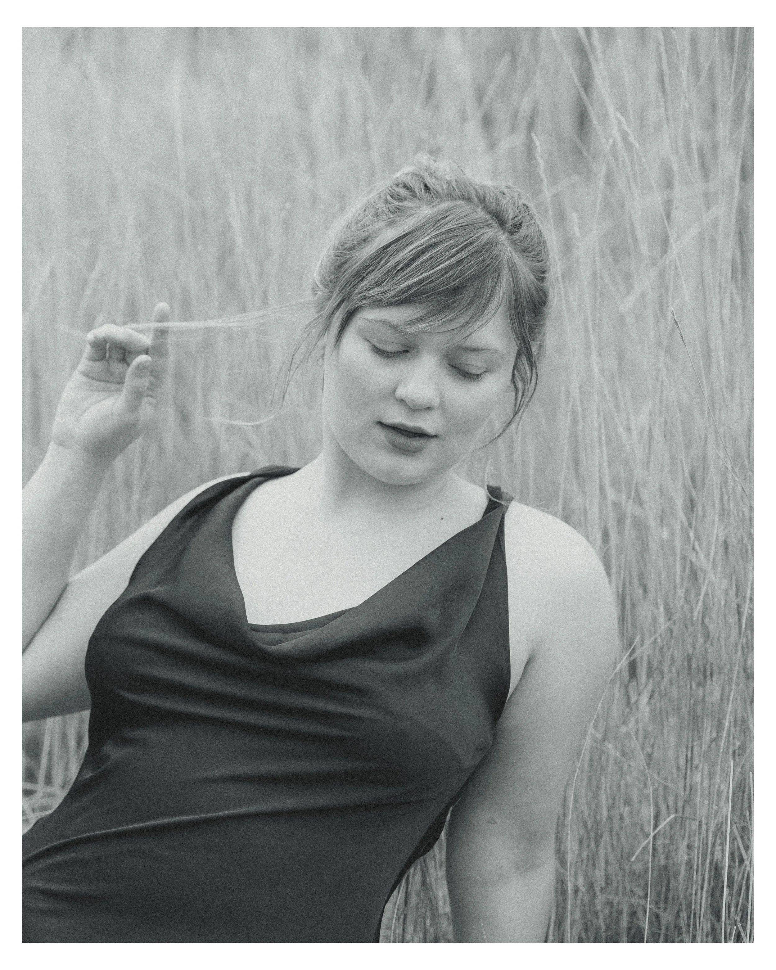  Fall senior portraits at South Mesa Trailhead in Boulder, Colorado featuring girl sitting in golden field.   