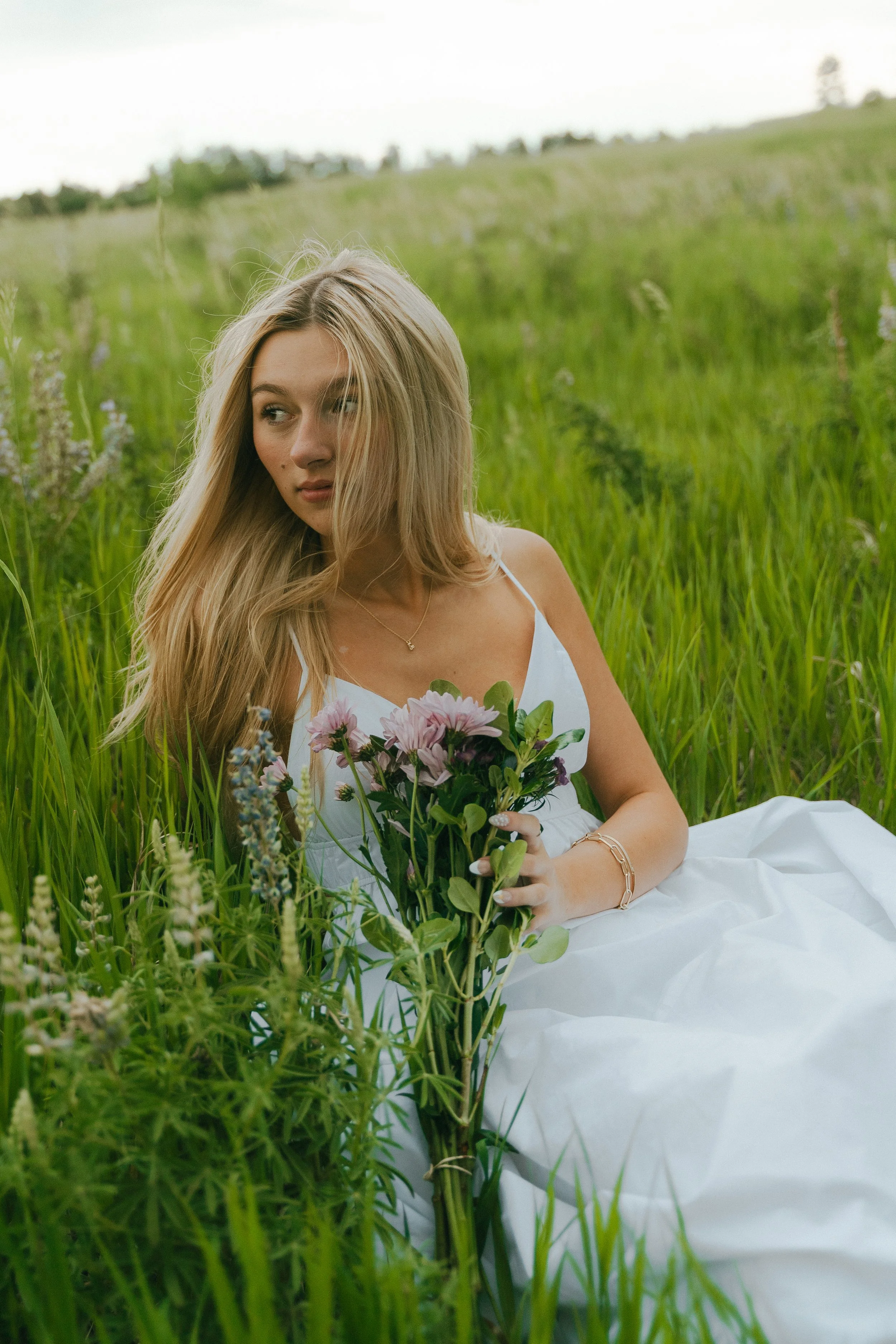  Summer senior portraits at Chautauqua Park in Boulder, Colorado on a windy day with mountain views.   