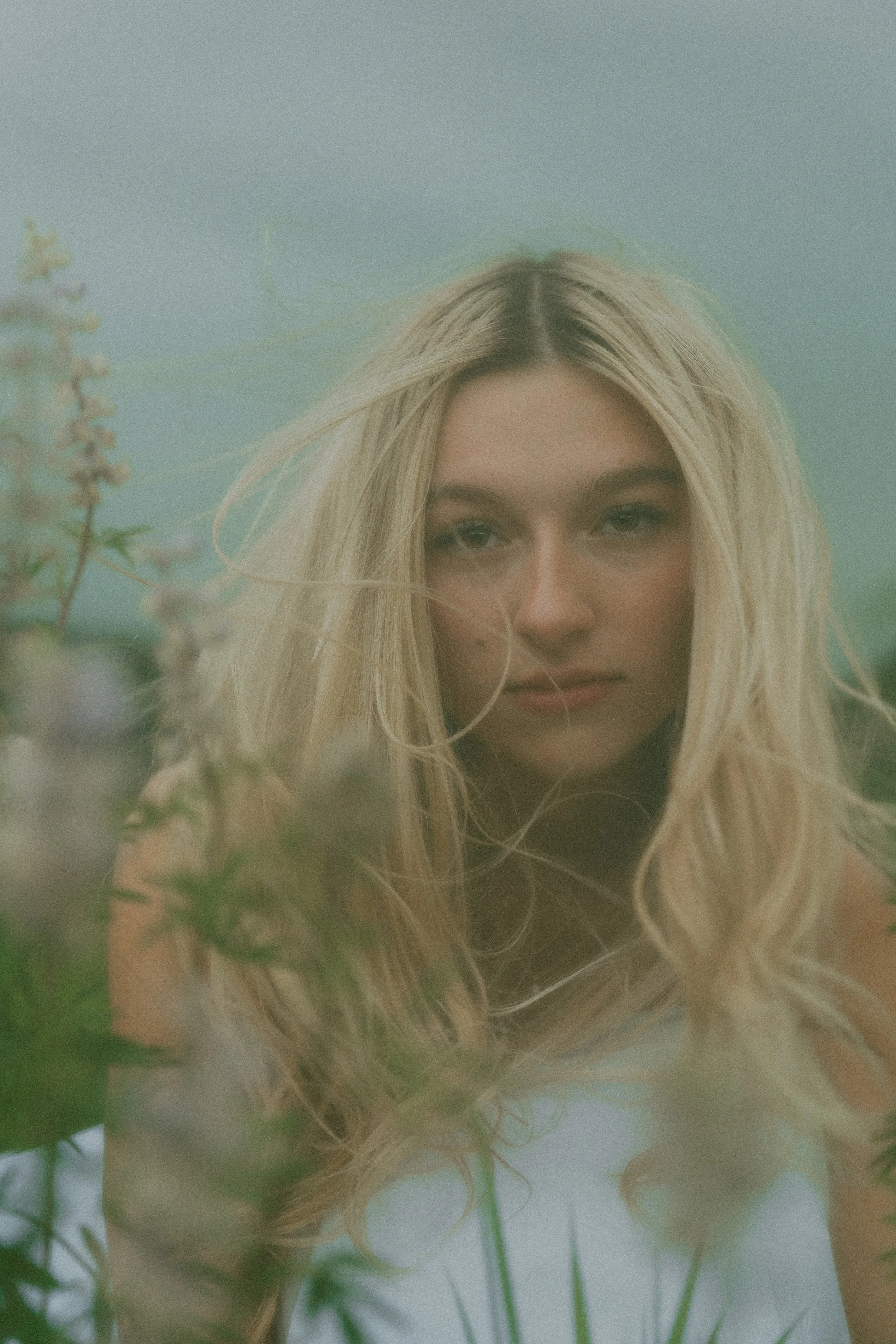  Summer senior portraits at Chautauqua Park in Boulder, Colorado on a windy day with mountain views.   