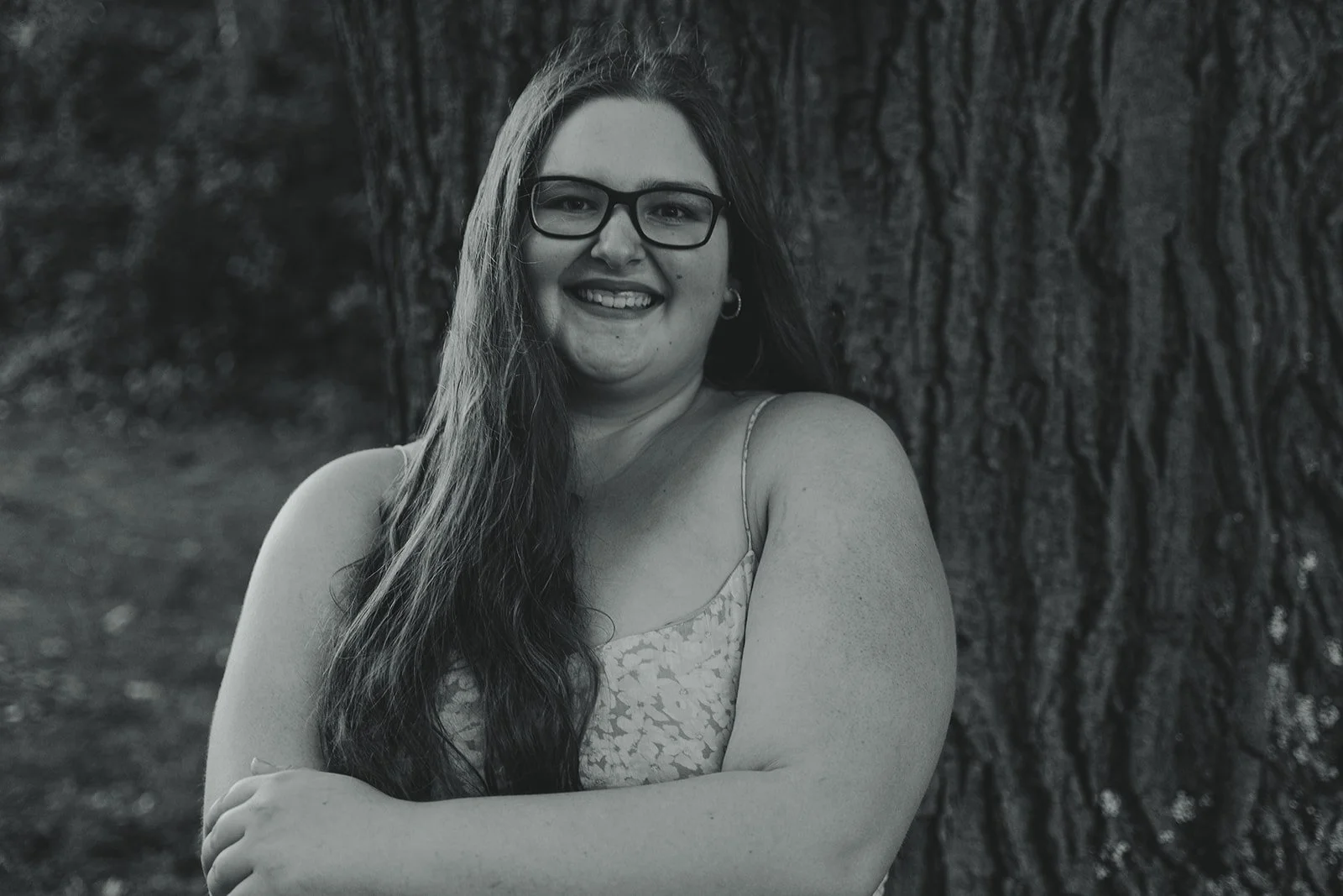 senior girl smiling for the camera for senior photos in boulder, colorado