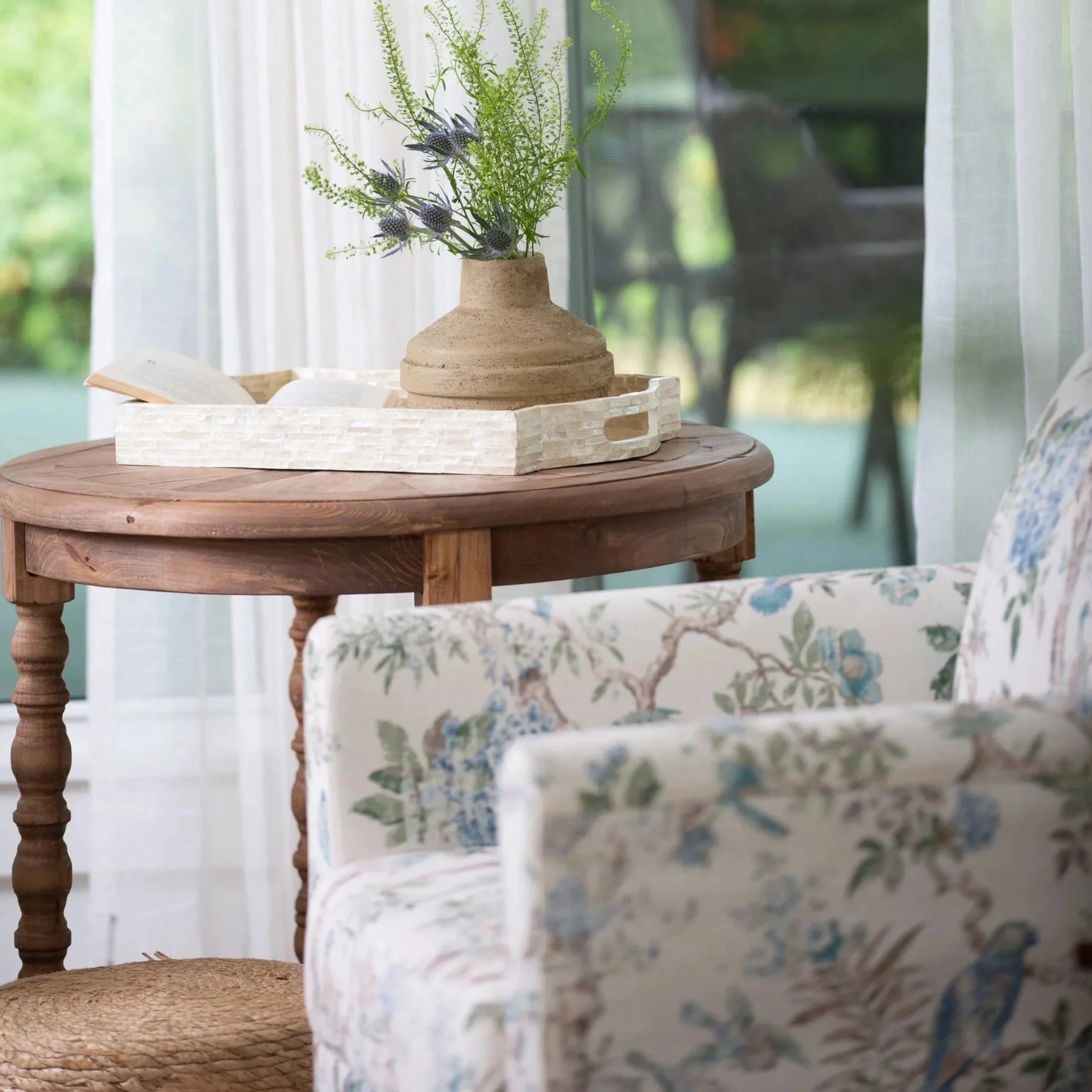 Interior designer conducting an in-home consultation with a homeowner to discuss remodeling, furnishings, and design planning.