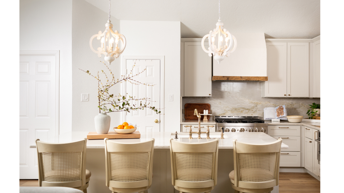 Bright white kitchen remodel demonstrating the Remodeling Ripple Effect, showing how layout, cabinetry, lighting, seating, flooring, appliances, and finish selections are all connected during a home renovation.