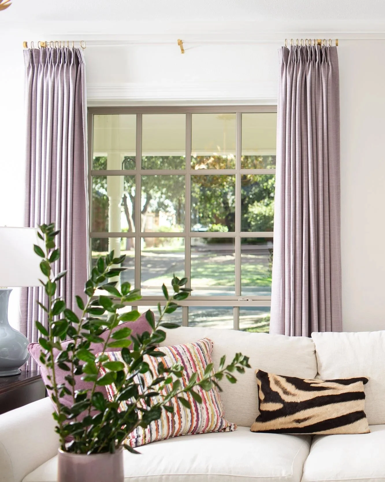 Interior design styling consultation featuring a furnished living room with custom drapery, layered décor, and curated furnishings by MASH Habitat Interiors.