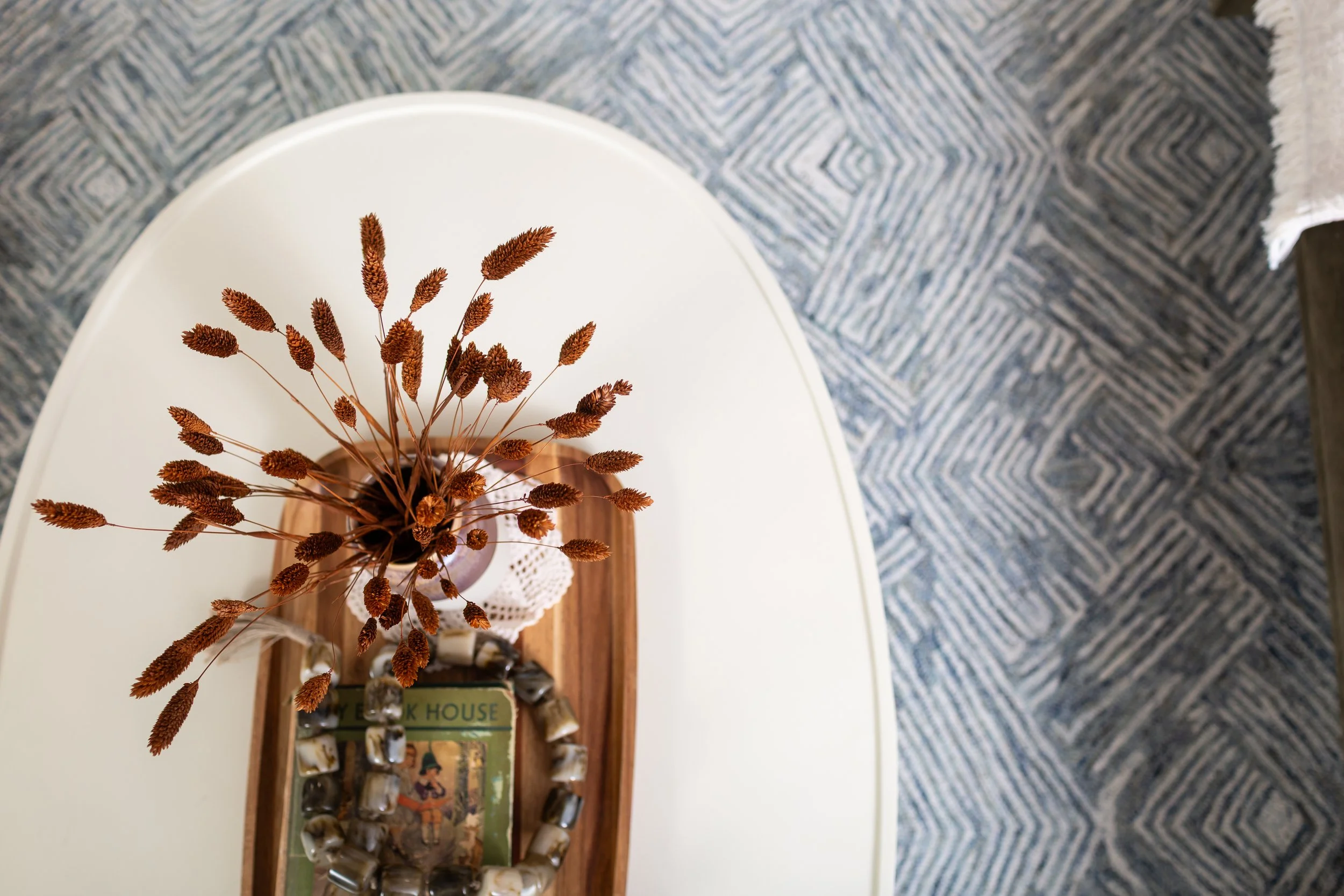 Interior styling details featuring layered decor, artwork, and wallpaper in a Fort Worth home designed by MASH Habitat Interiors.