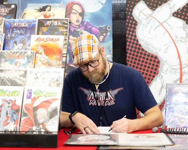 Comic artist Matt Campbell draws at a Colorado Comic Convention.
