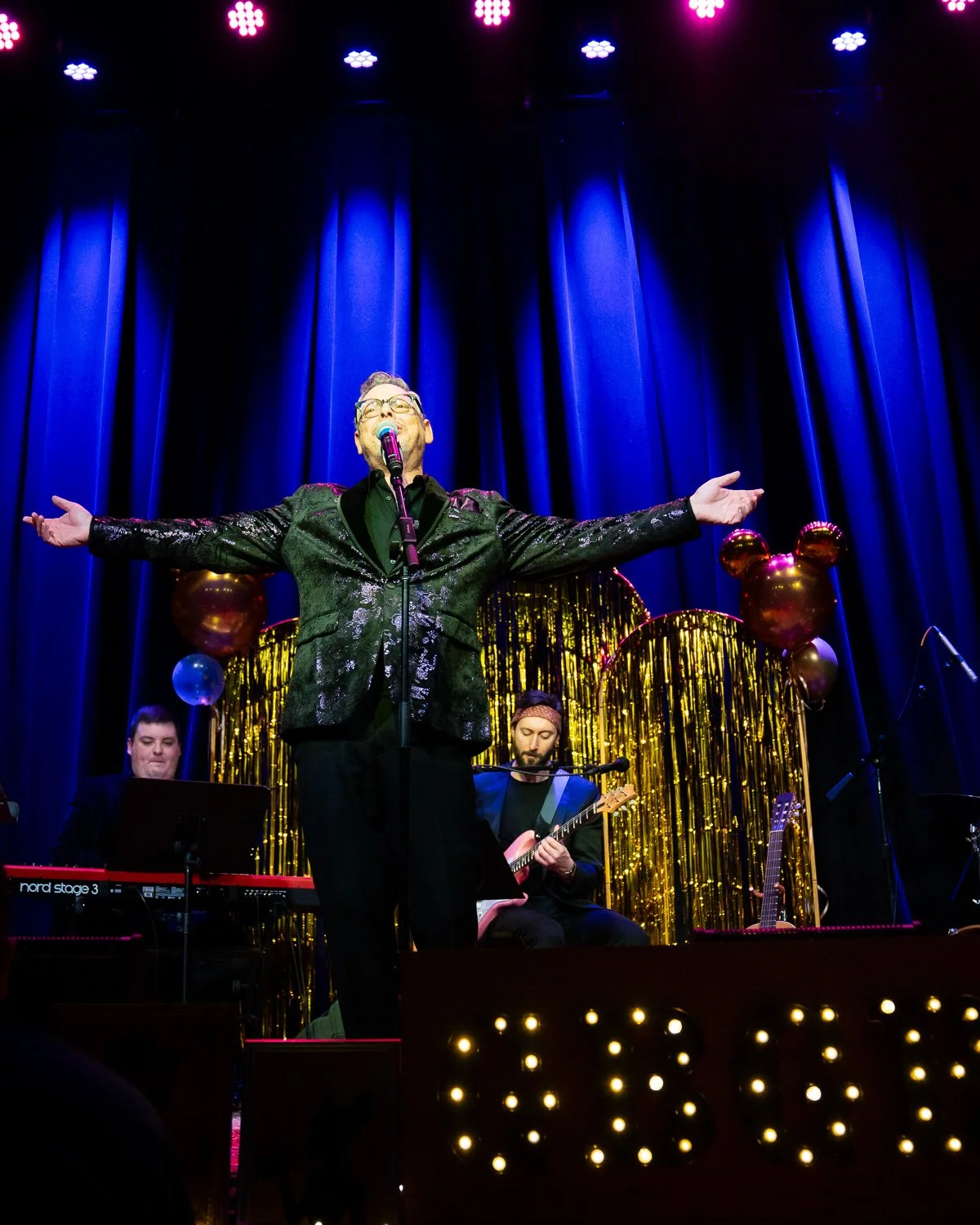 Singer Belting with arms outstretched at GBGB performance at natalie's grandview, taken by event photographer steve miller of marked imagery.