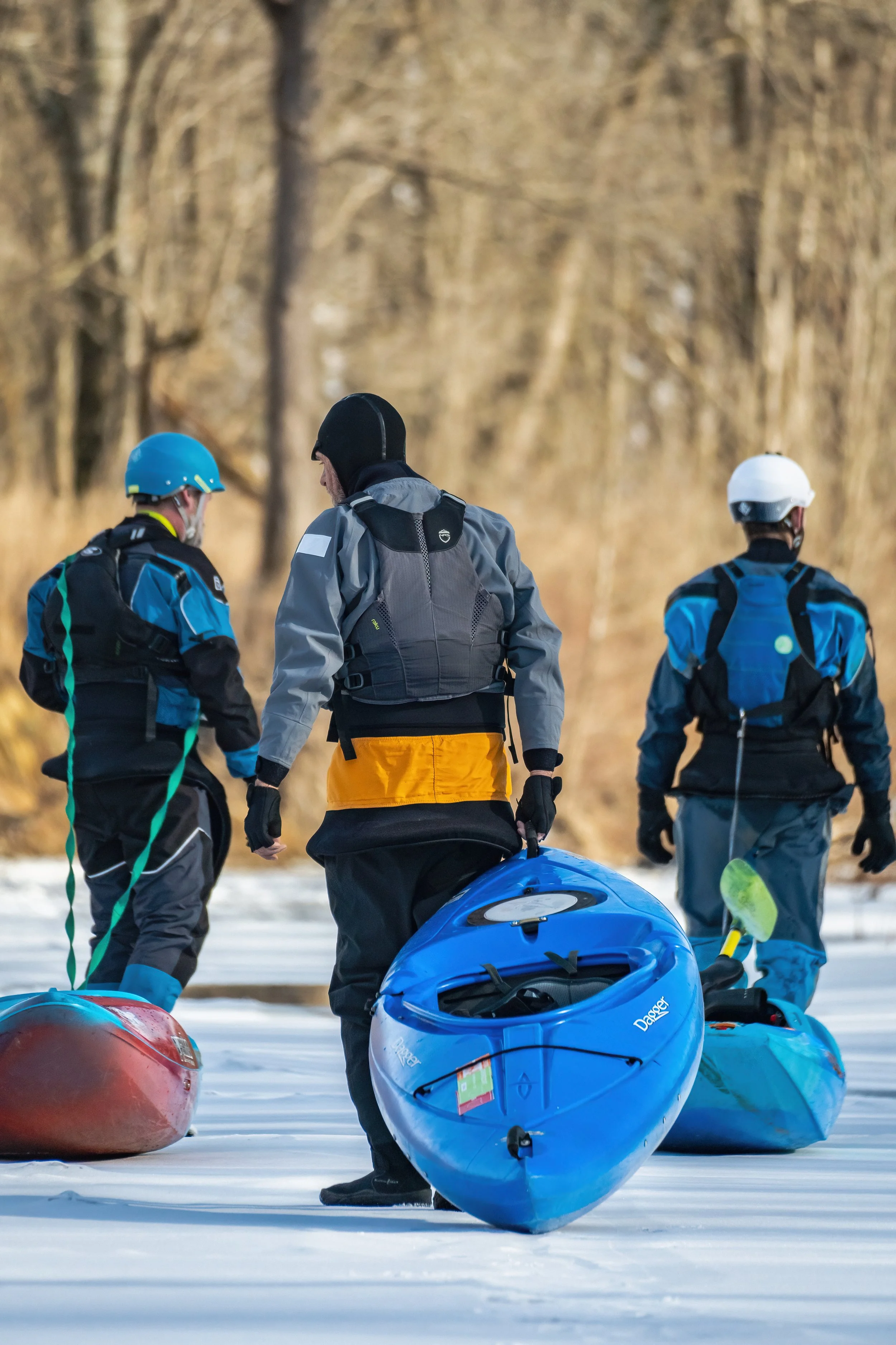 kayakers pulling kayaks on ice on frozen river blackhand gorge