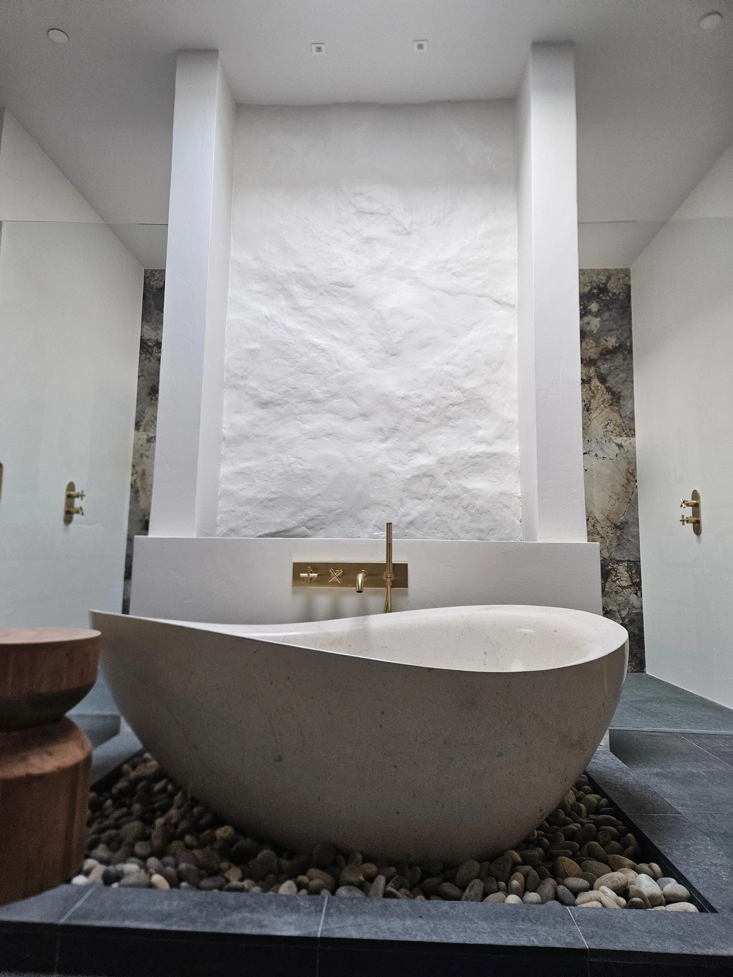 Stone texture was added to this bathroom to add to the natural, earthy feel.