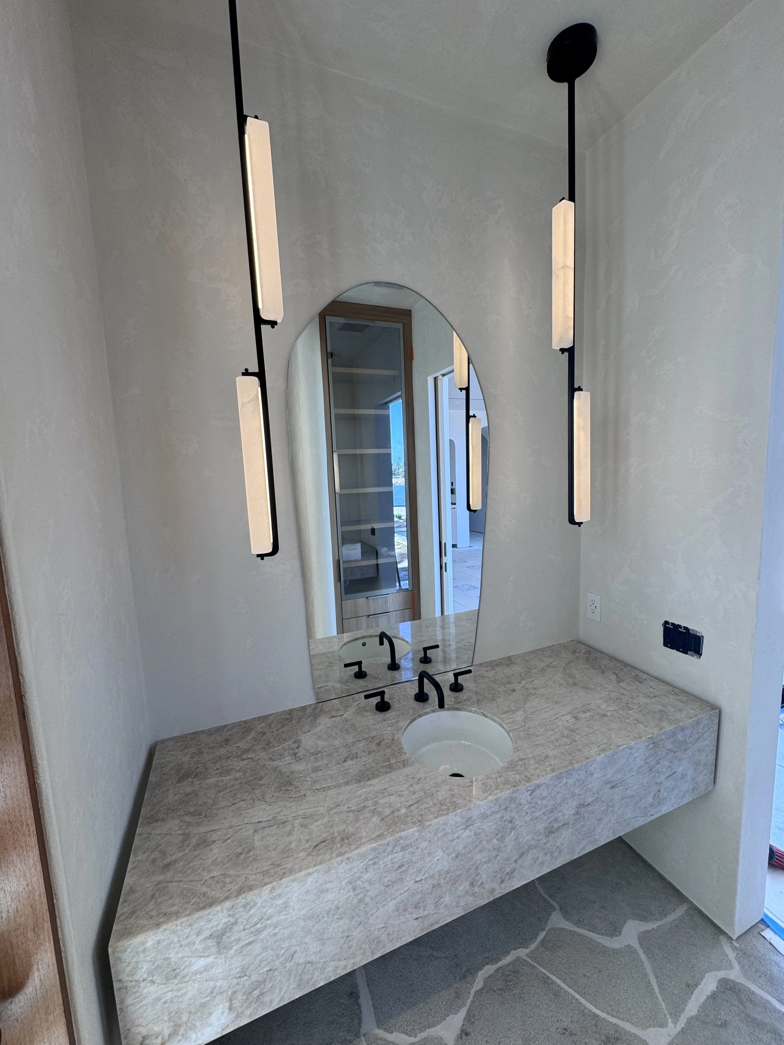 The hand applied texture in this bathroom complimented the stone work beautifully.