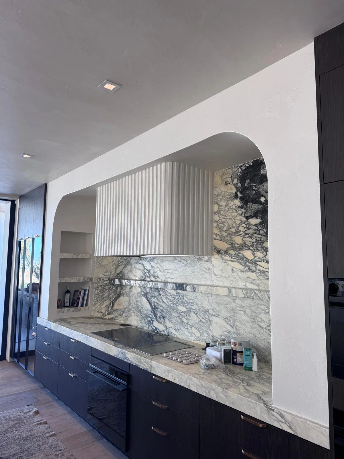The ceiling and walls were coated in this kitchen as well as a custom range with vertical texture.