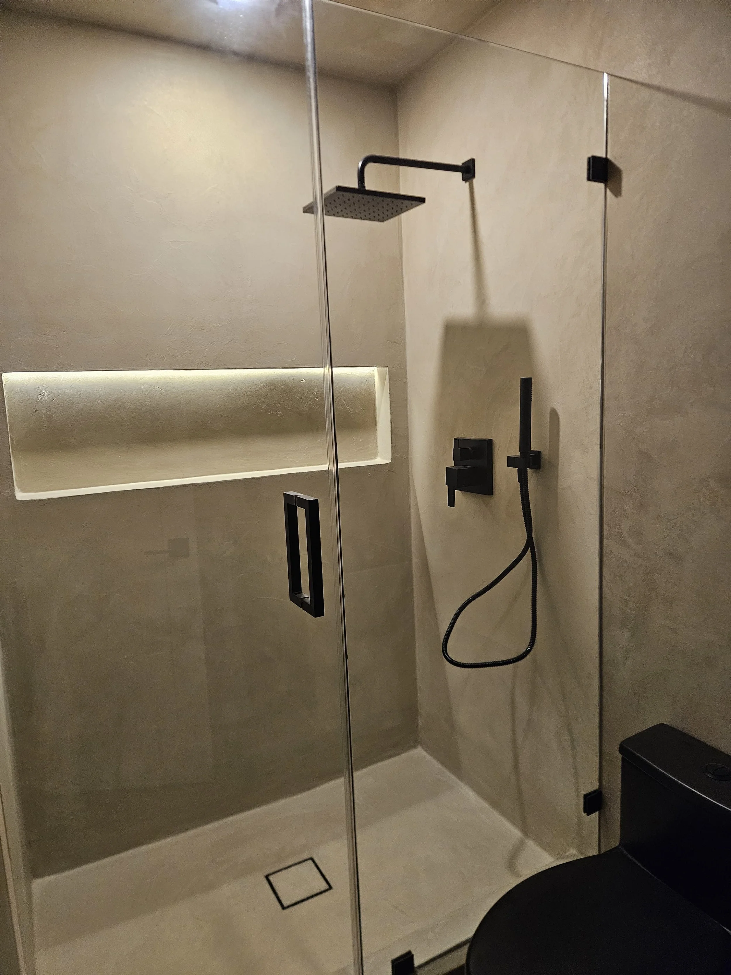 Another shower fully coated in micro cement.