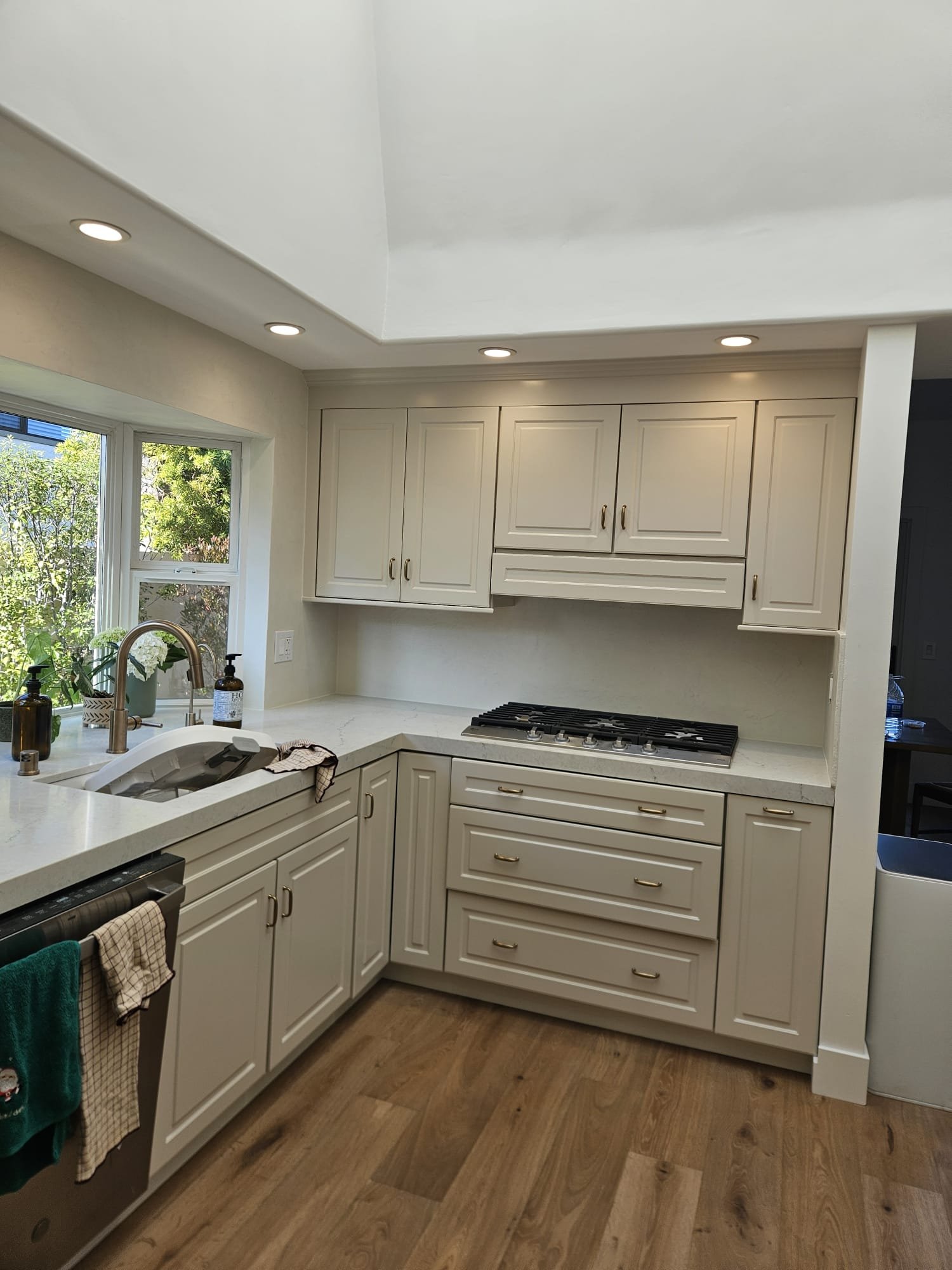 *AFTER* Micro cement was applied over the existing tile backsplash in this kitchen. Resulting in an updated, clean finish.
