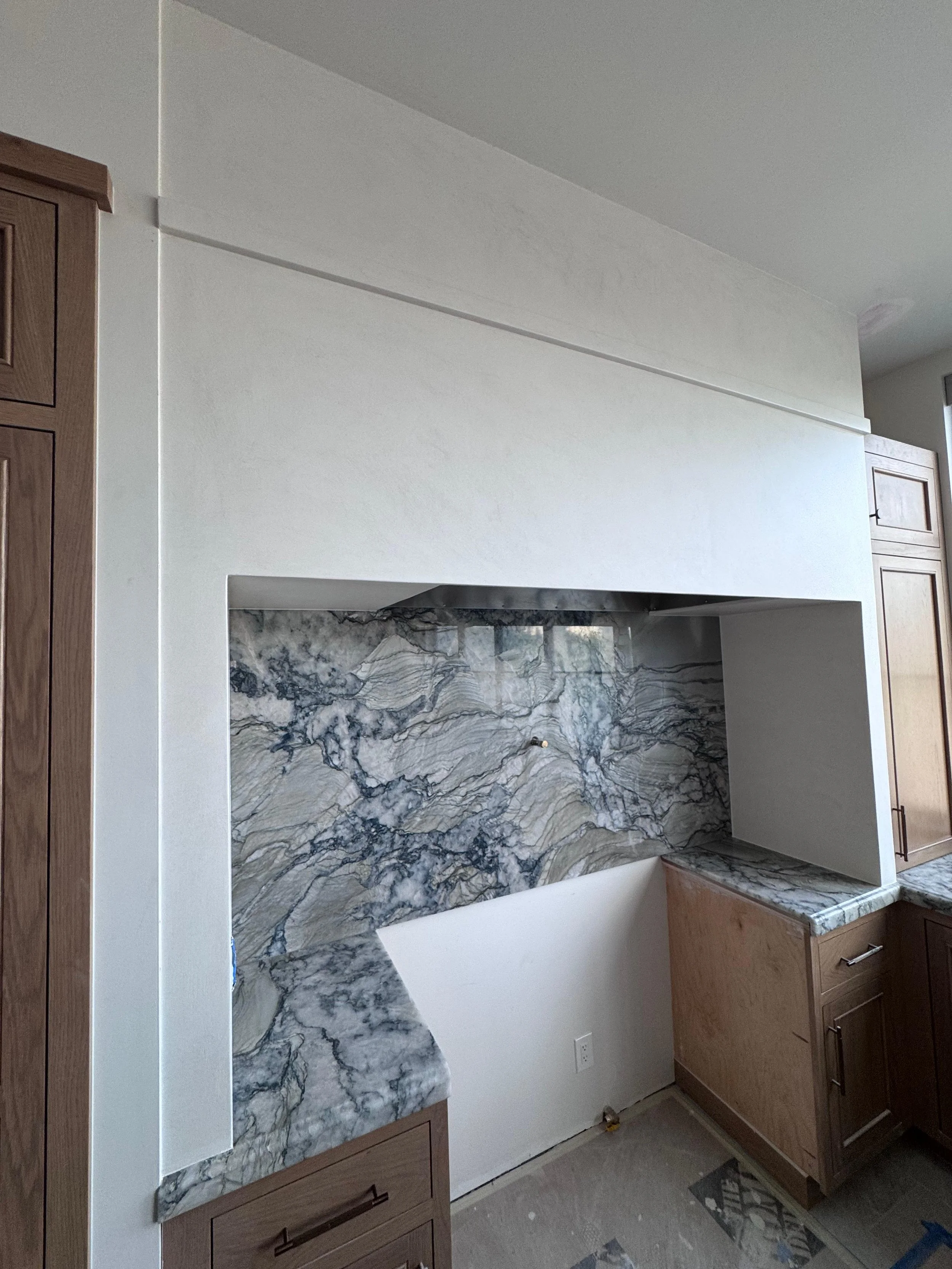 Kitchen range hood with a smooth finish.