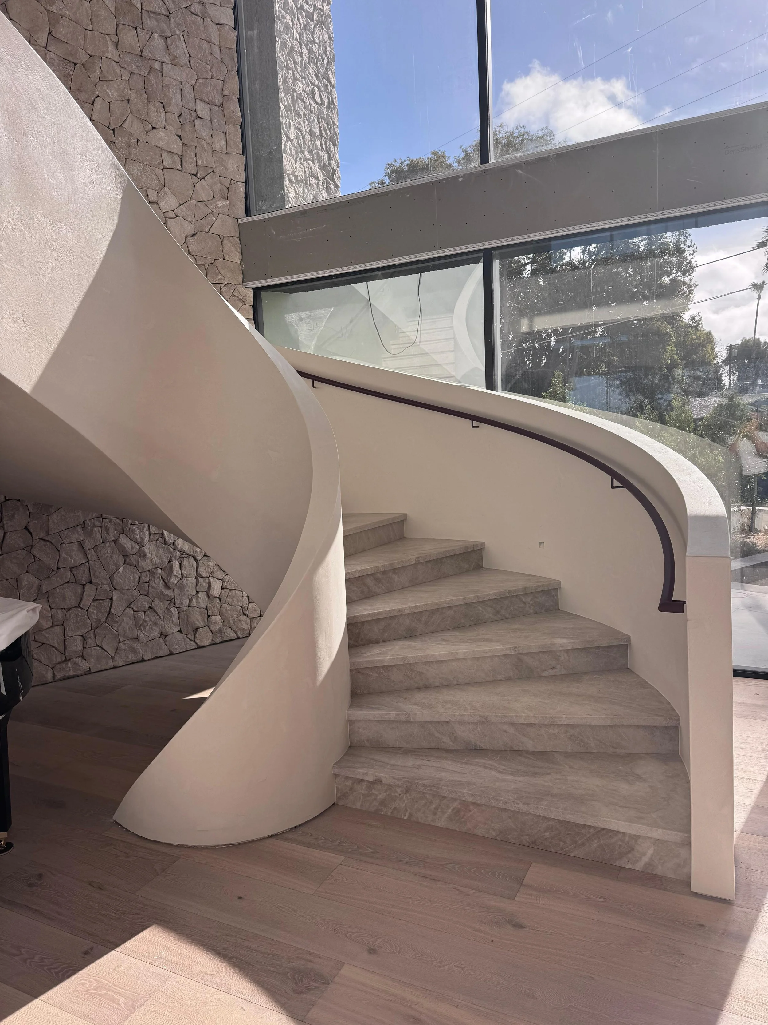 A one-of-a-kind staircase with coated walls.