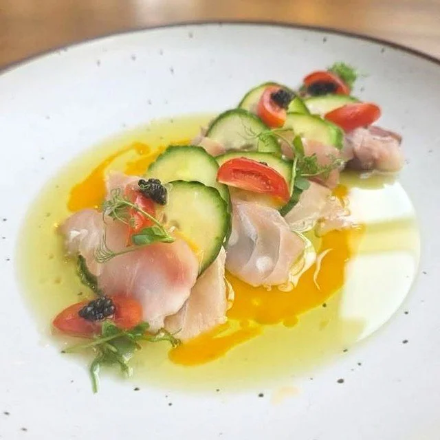 Cherry wood smoked red snapper, cucumber, coconut Sriracha vinaigrette, heirloom cherry tomatoes, caviar, and pea tendril micros from Chef Robbie Tremblay at Amherst Oyster Bar.⁠
⁠
#snapper #crudo #amherst #amherstma #wulfsfish #newfisholdschool⁠