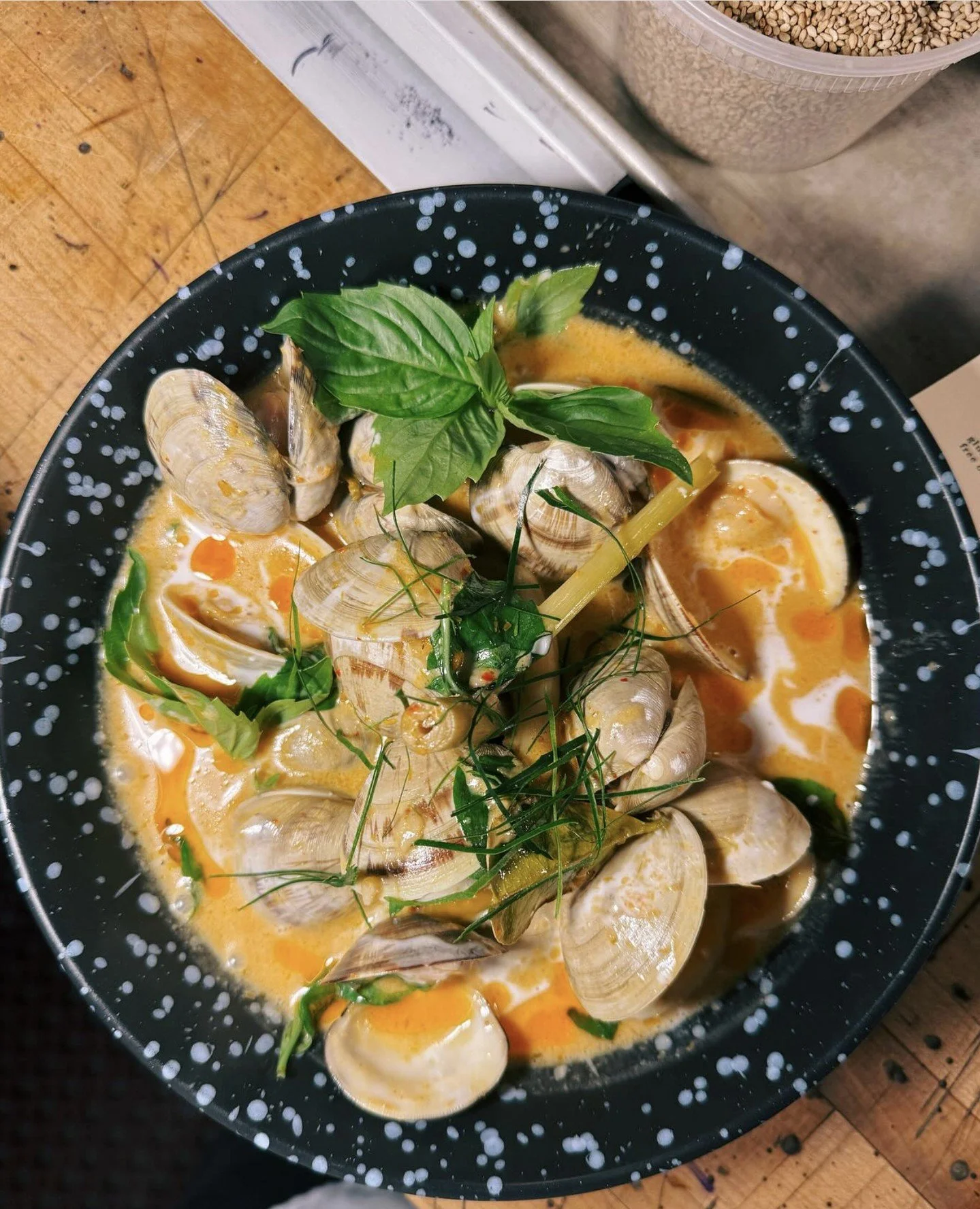 Panang clams with basil from Little Trúc in Easthampton, Mass. Gem clams, house panang paste, coconut cream, lime leaf, lemongrass. ⁠
⁠
#gemclams #wulfsfish #newfisholdschool