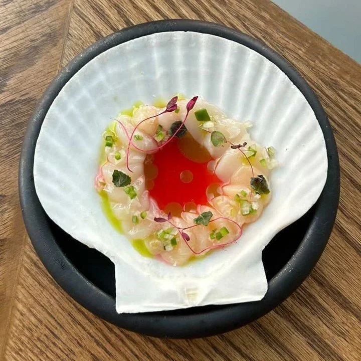 Bay Scallop crudo with blood orange sauce, tarragon oil, and shallot and Serrano relish from sous chef Meegan Minahan of Perch in Boston. ⁠
⁠
#bayscallops #bostonchefs #wulfsfish #newfisholdschool