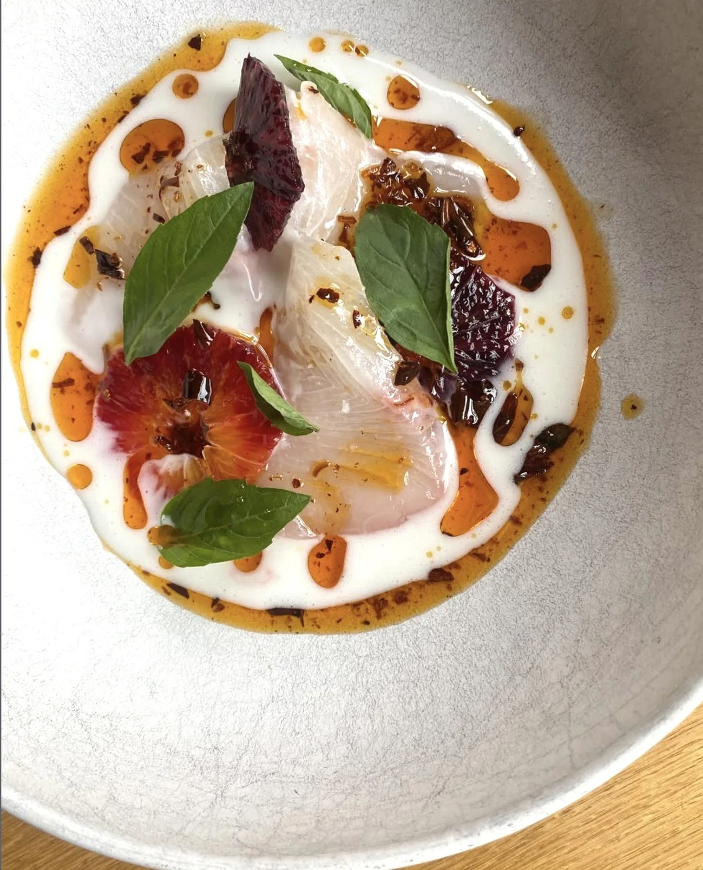 Hiramasa, coconut, blood orange, chili crisp from Chef Gabe at Gray's Hall.⁠
⁠
#crudo #bostonchefs #wulfsfish #newfisholdschool