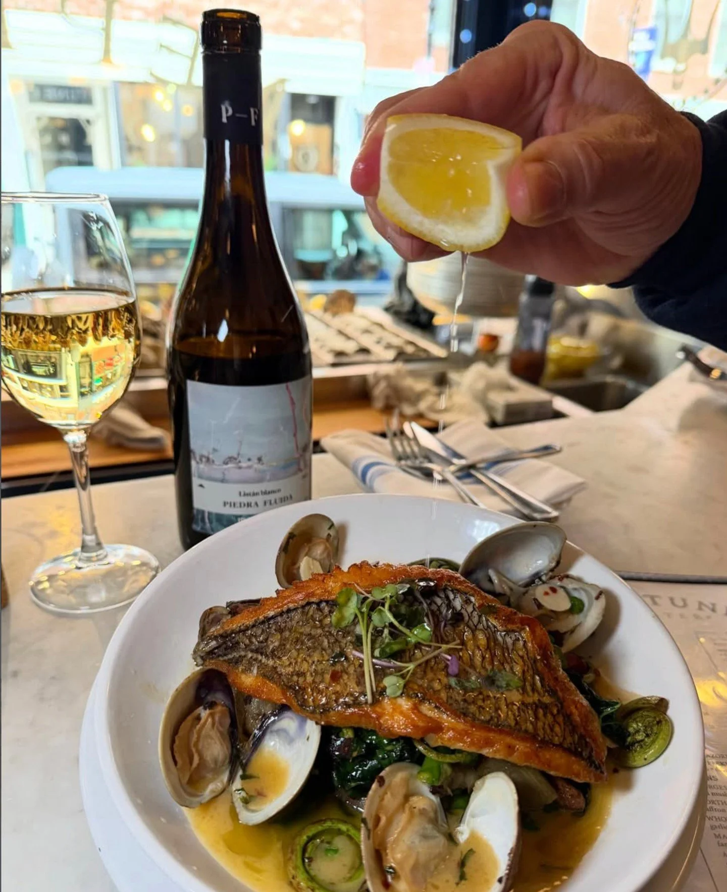 Everything you could want in one dish &mdash; South Coast Black Bass with spring artichoke vignarola, pancetta, green garlic, and Atlantic kelp butter at Neptune Oyster. ⁠
⁠
#bostonchefs