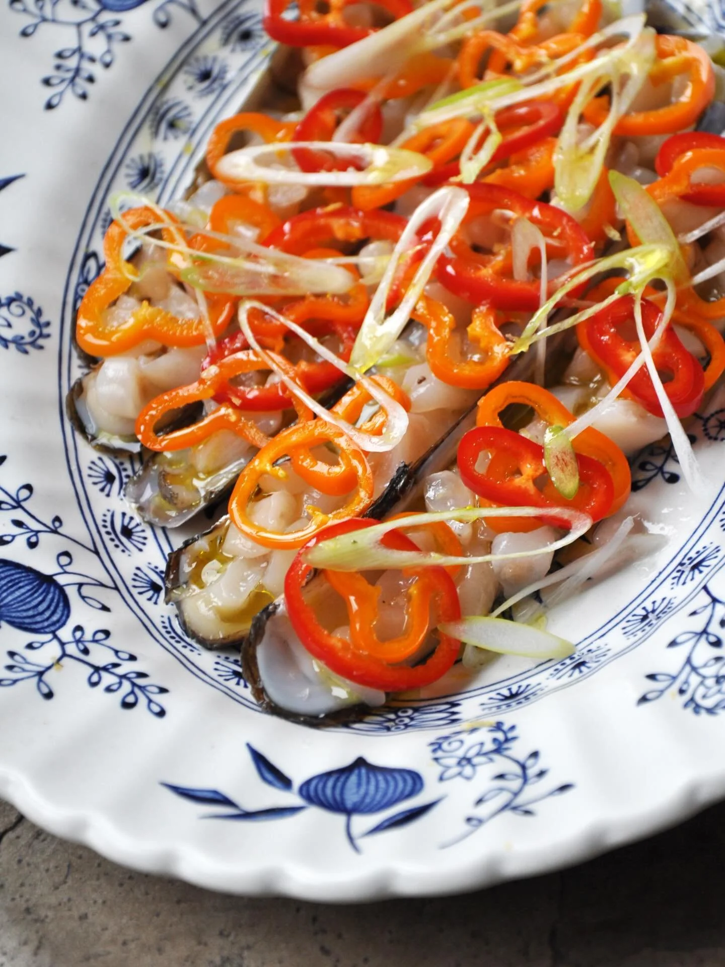 Razor clams with pickled chilis, green onions, lemon zest by Chef Eric Korsh of CRU on Nantucket. For those of you already making summer plans, CRU opens for the season May 7 and starts taking reservations April 7.

Chefs &mdash; We&rsquo;ve got a fr