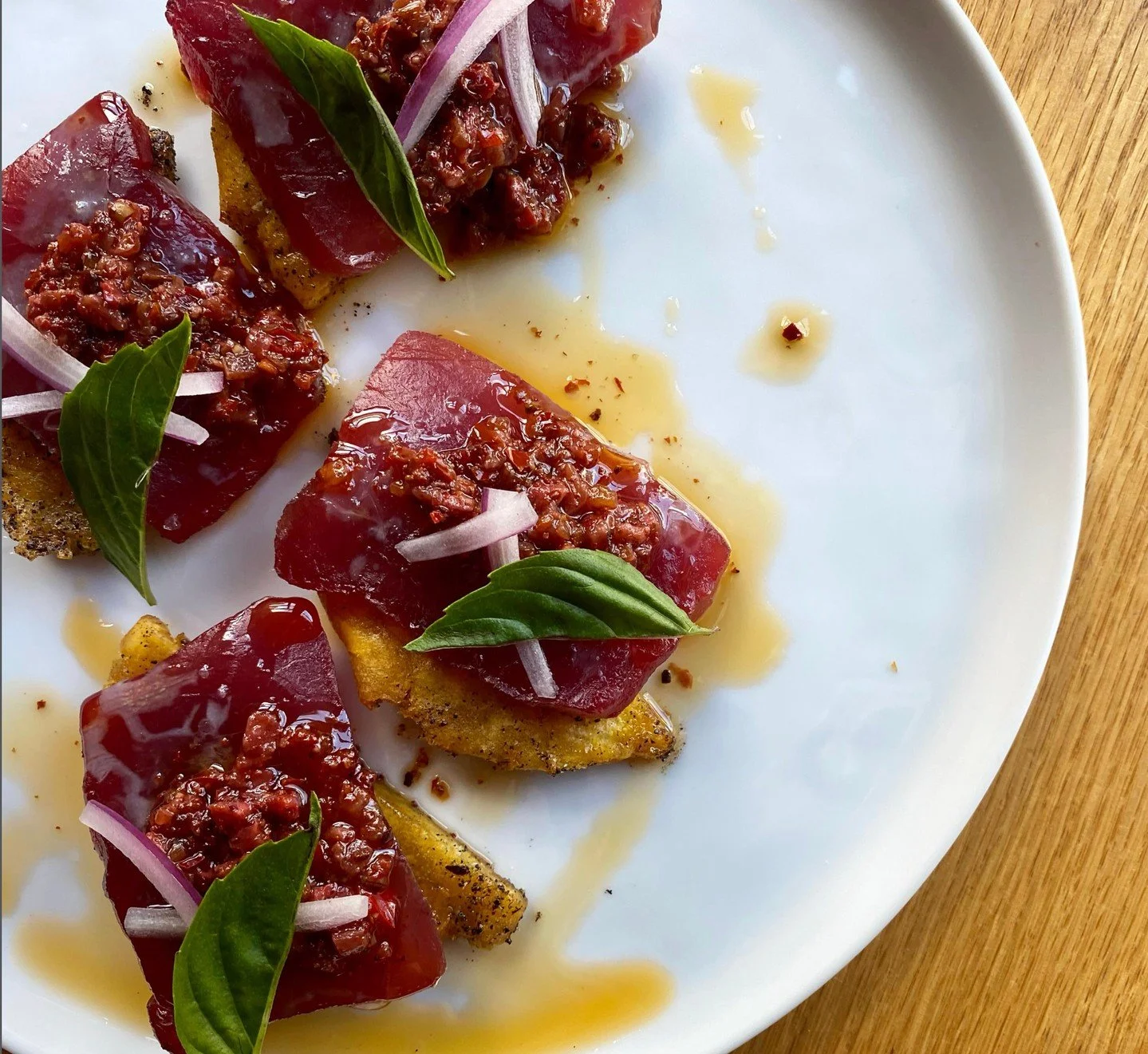 Tuna Tostones⁠
Strawberry rose harissa, black lime, red onion, basil from Chef Gabe at Gray's Hall. ⁠
⁠