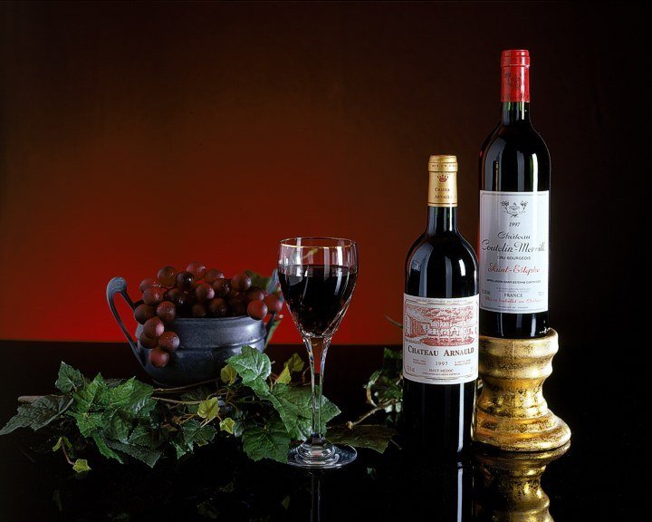 STILL LIFE PHOTO, COVER SHOT FOR WINE PUBLICATION -
Low-Key photo uses classic product lighting that produces a pleasing specular highlight on the glass. Shot pre-digitally on 4x5 view camera.