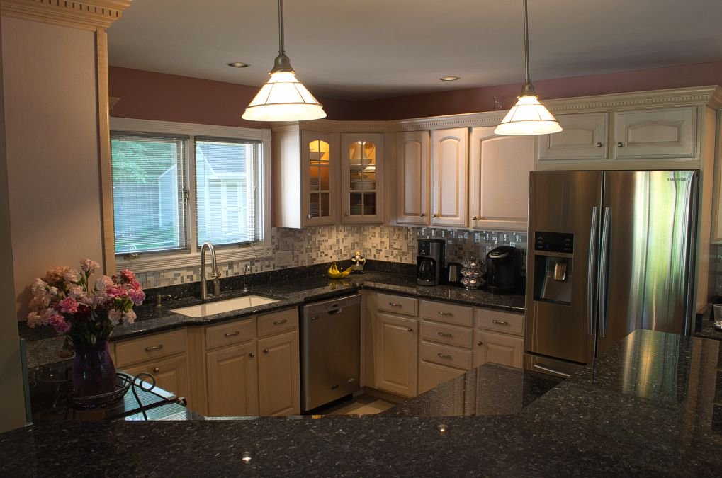 HDR Application: Interiors -
One of the three original (mid-range) pre-hdr photos of the kitchen. Note that exposure sacrifices occur in the single shot, and would take significant post-production image editing to improve the photo.