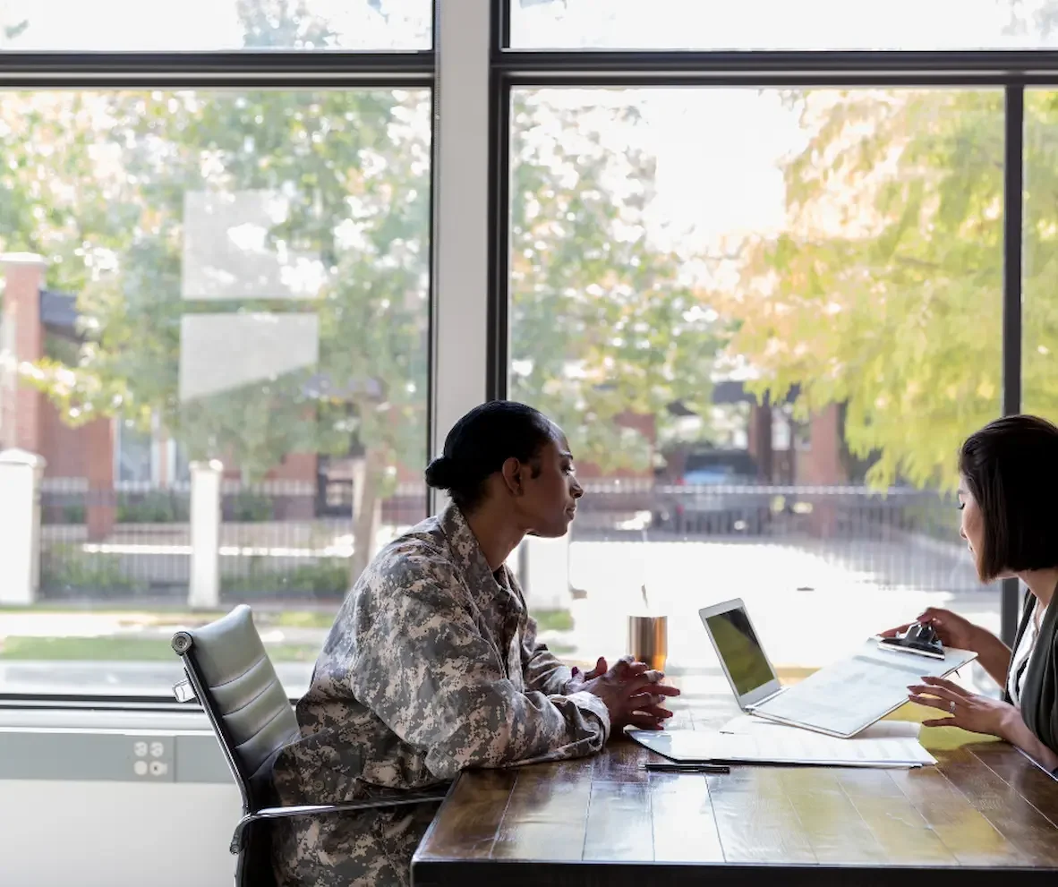 Veteran meeting with a VA claims consultant to discuss deferred claim status and next steps