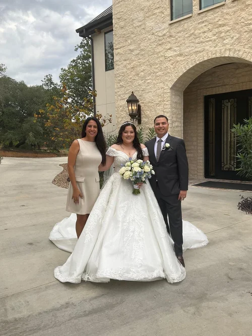 Wedding officiant with couple