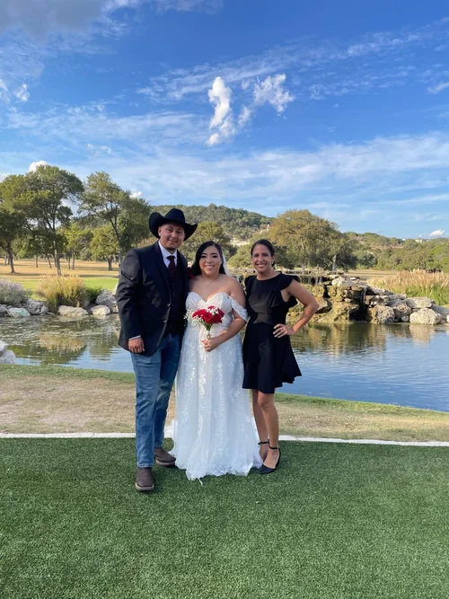Wedding officiant with couple