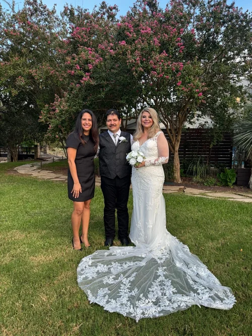 Wedding officiant with newlyweds