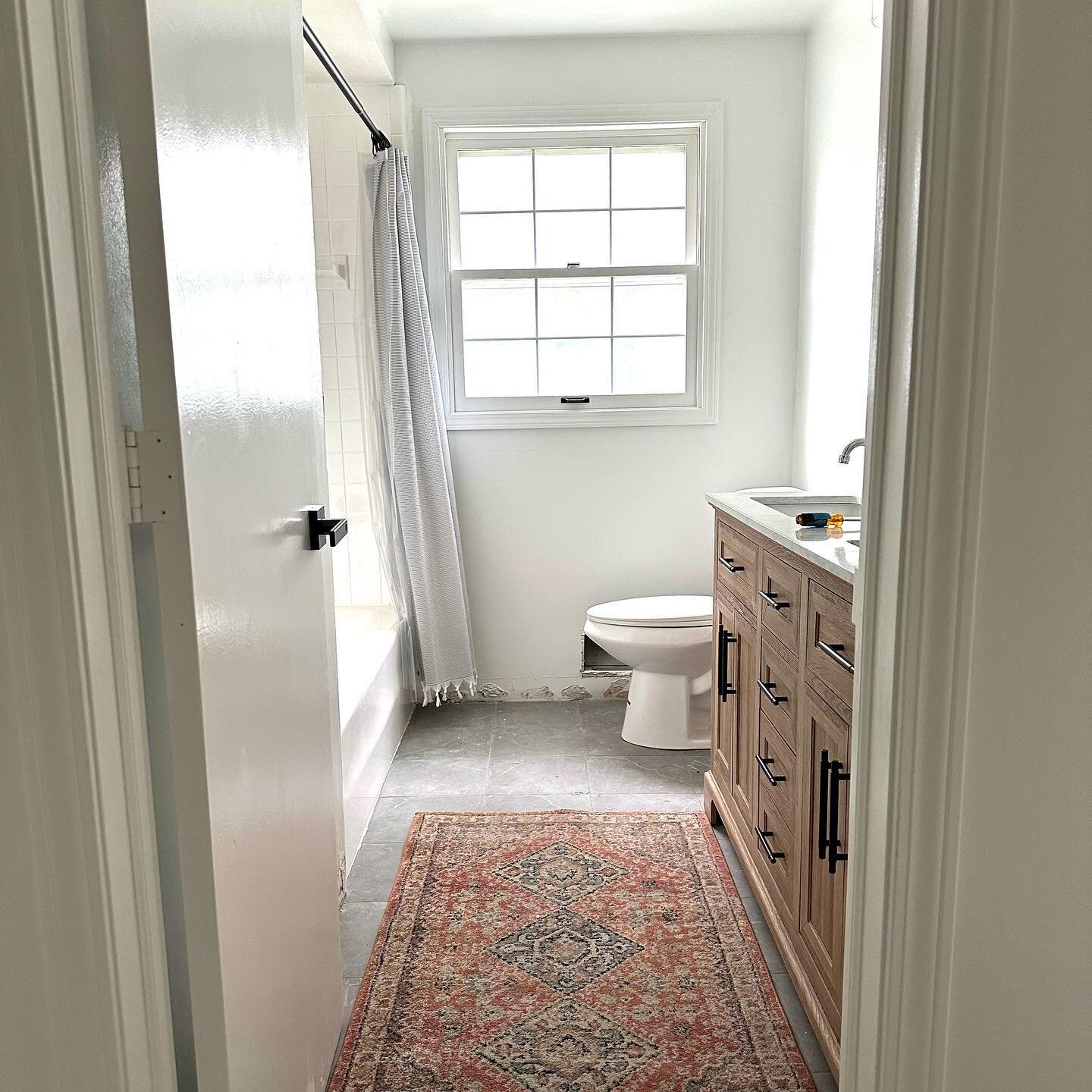 We still have some finishing touches (like trim) but the before/after of our main bathroom is just too good not to share!! 🥰