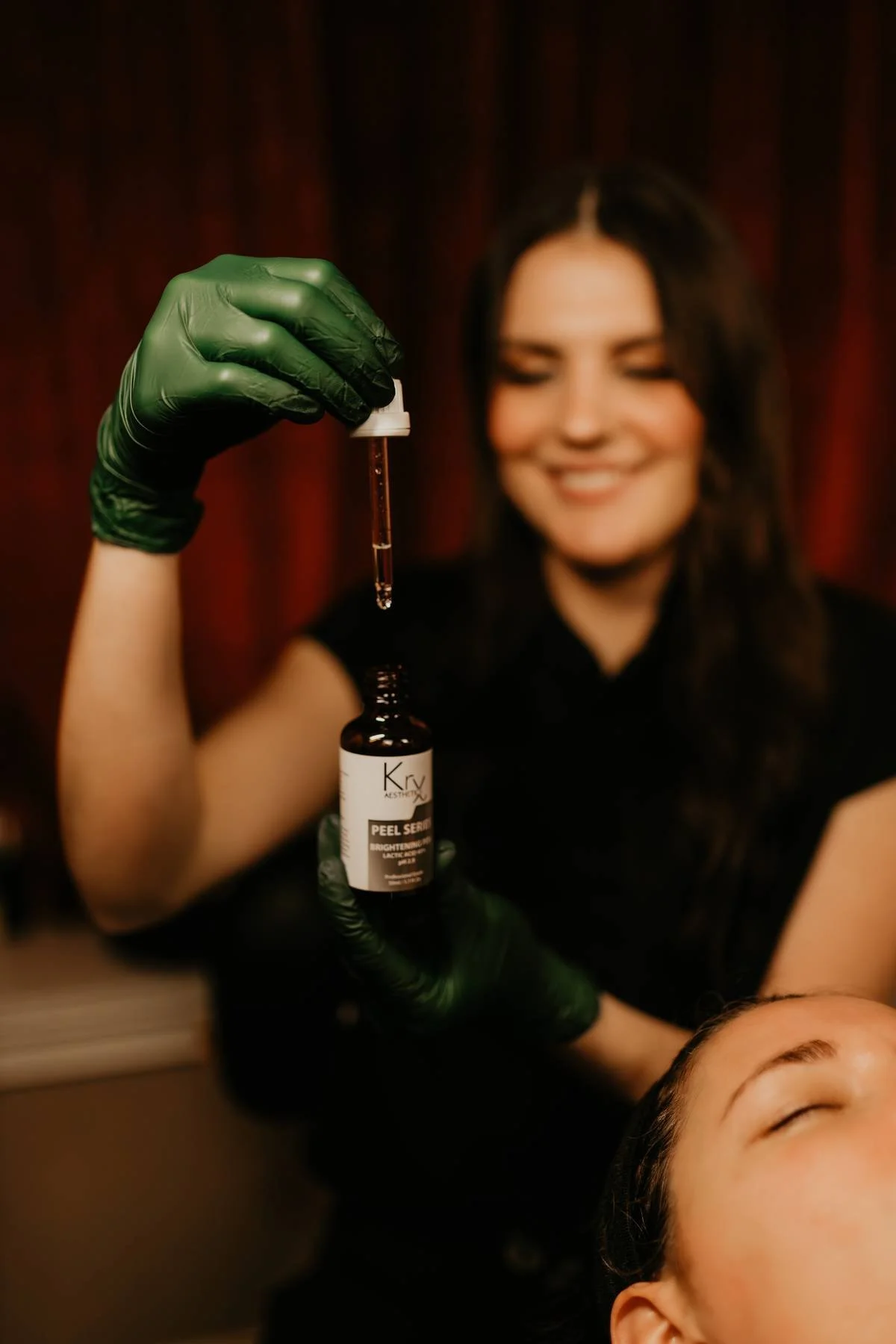 esthetician in huntington, wv performing a chemical peel facial