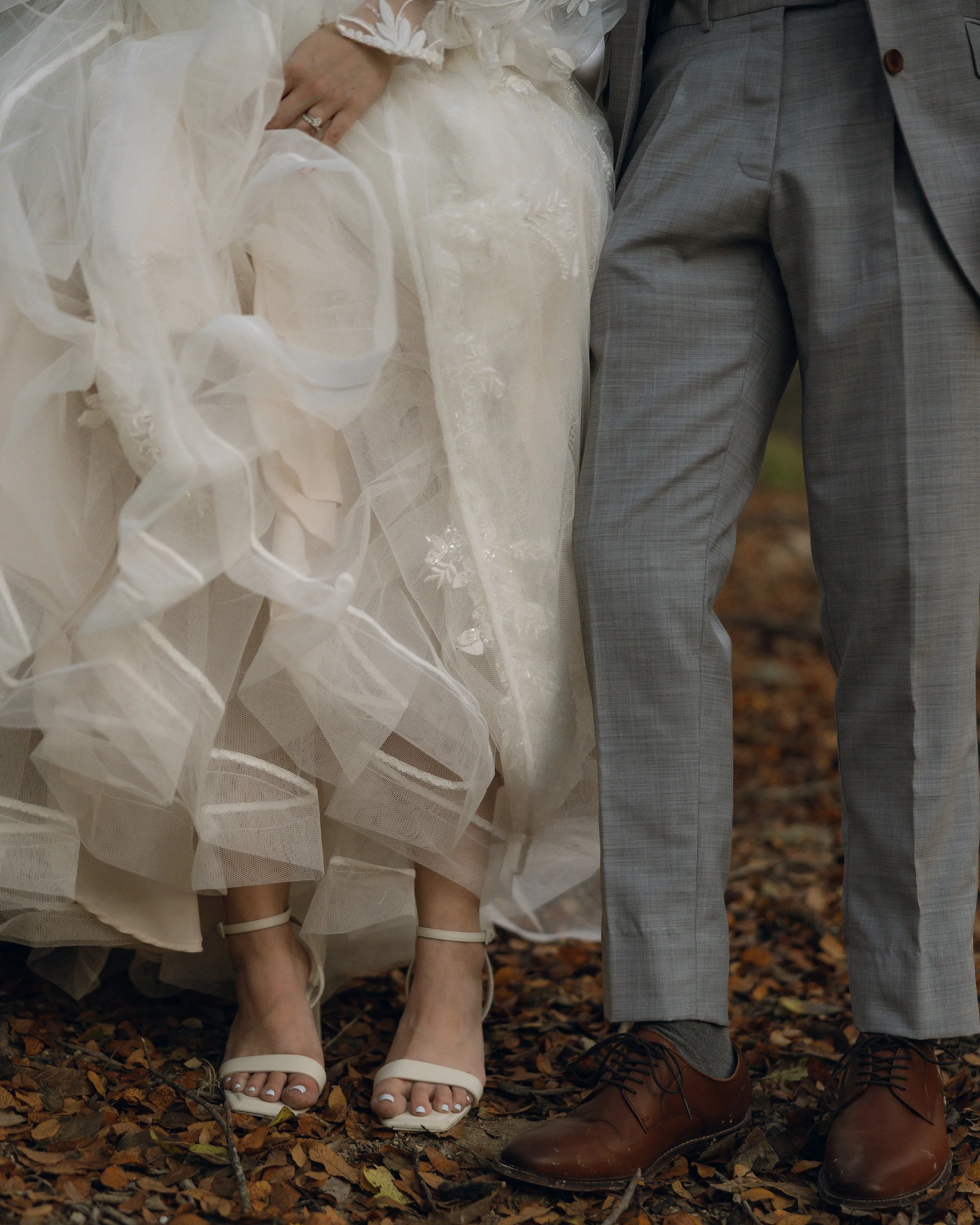 Couple standing on autumn leaves