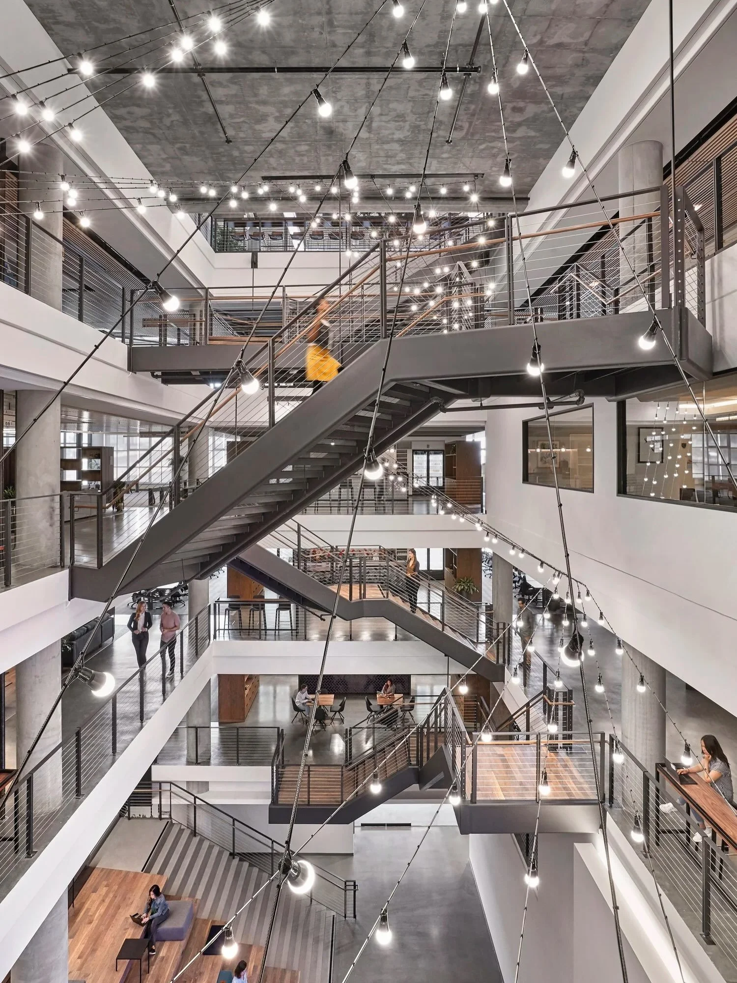 A thread of light through six stories.

Designed around a central atrium that connects nearly every level of this Bay Area headquarters, the workplace turns circulation into a place for gathering and connection. A sweeping installation of suspended l