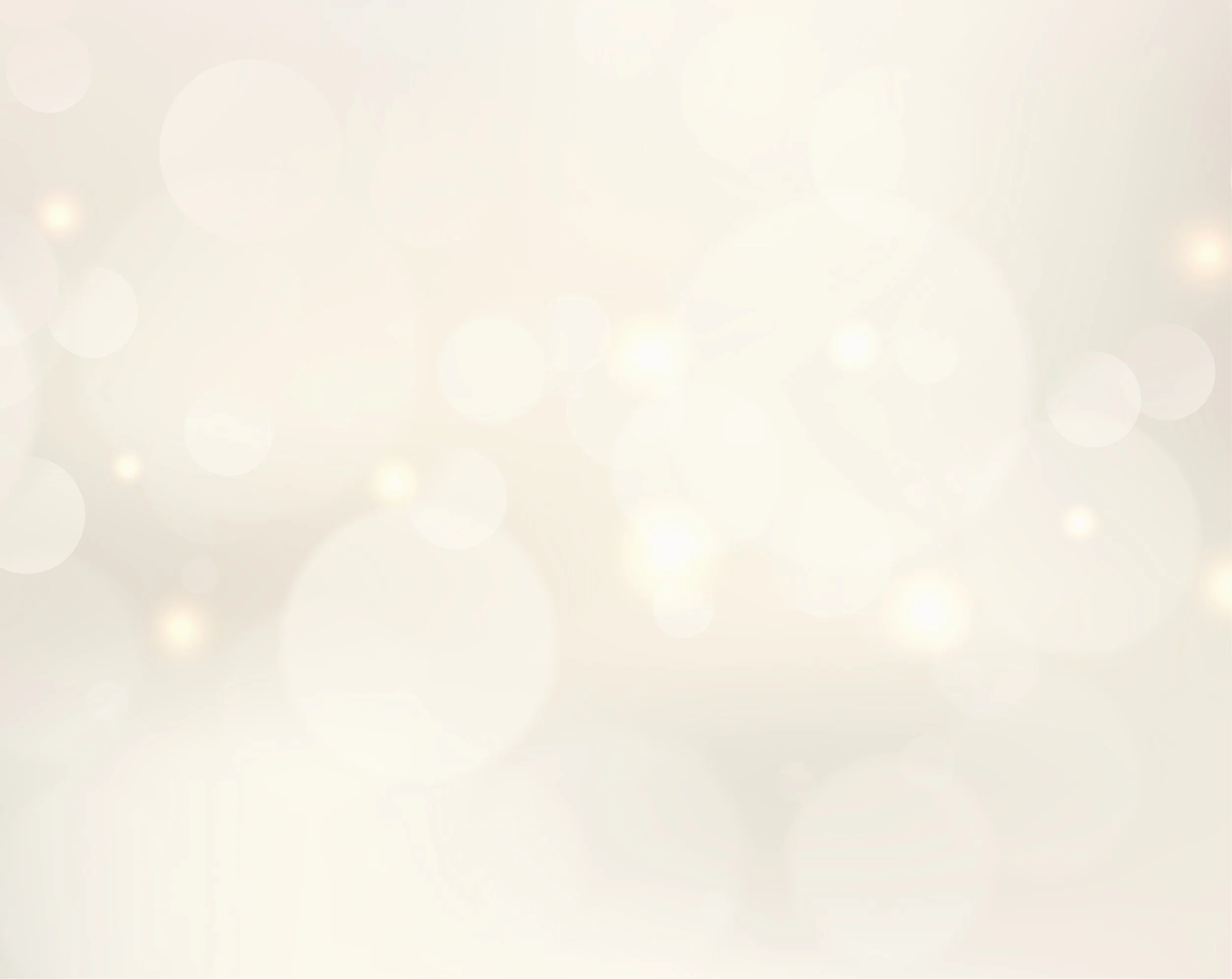 Soft blurred light beige background with bokeh effect and circular light spots.