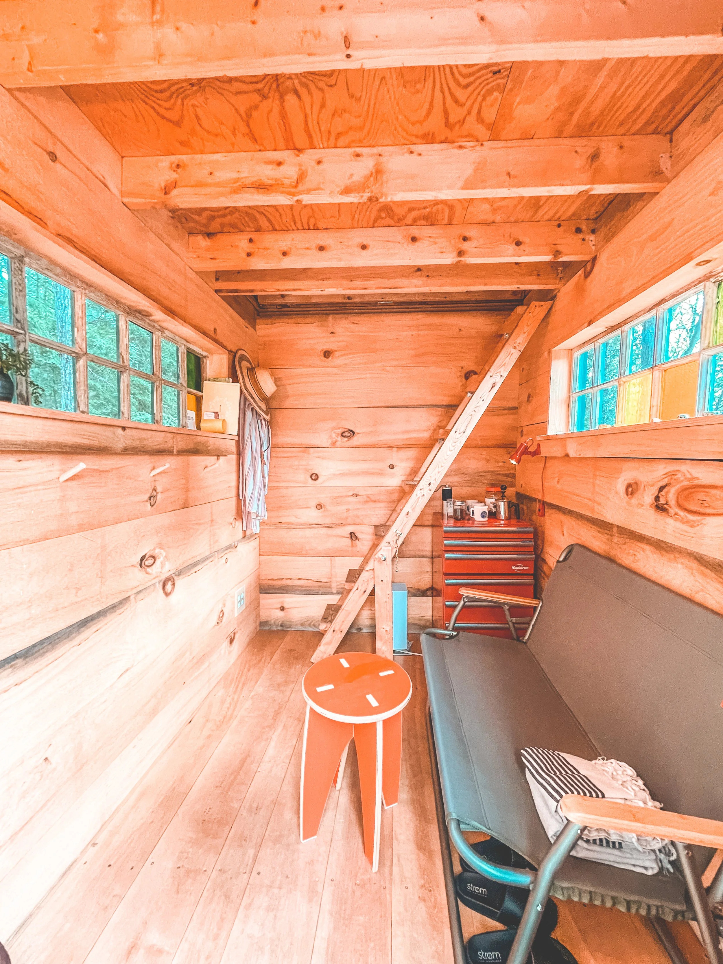 downstairs inside the tiny cabin, has electricity/heating/fridge