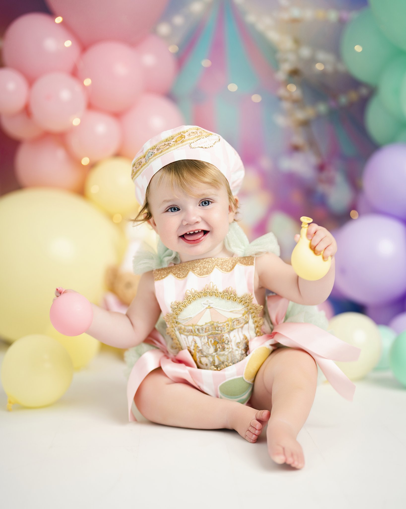 baby with balloons