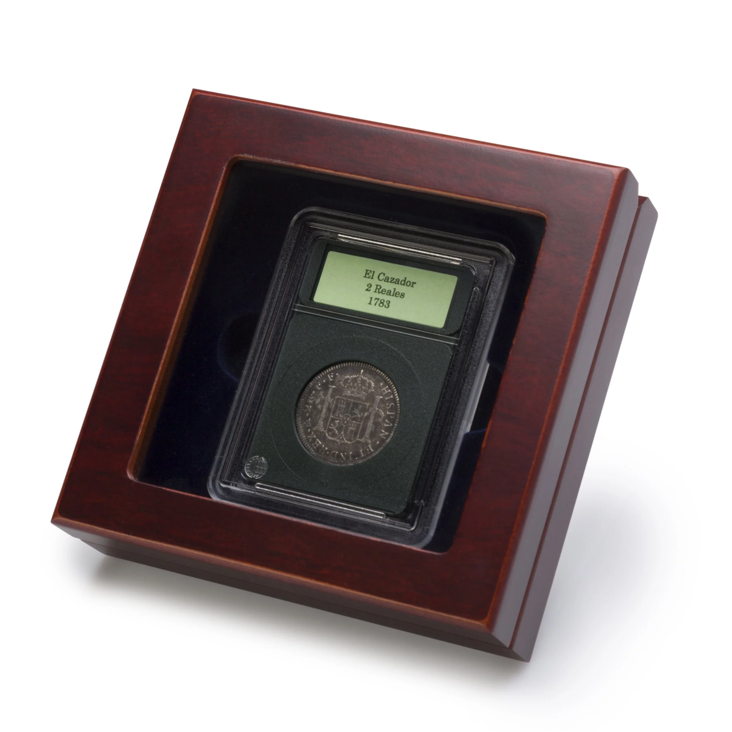 El Cazador 2 Reales coin from 1783 in a display case