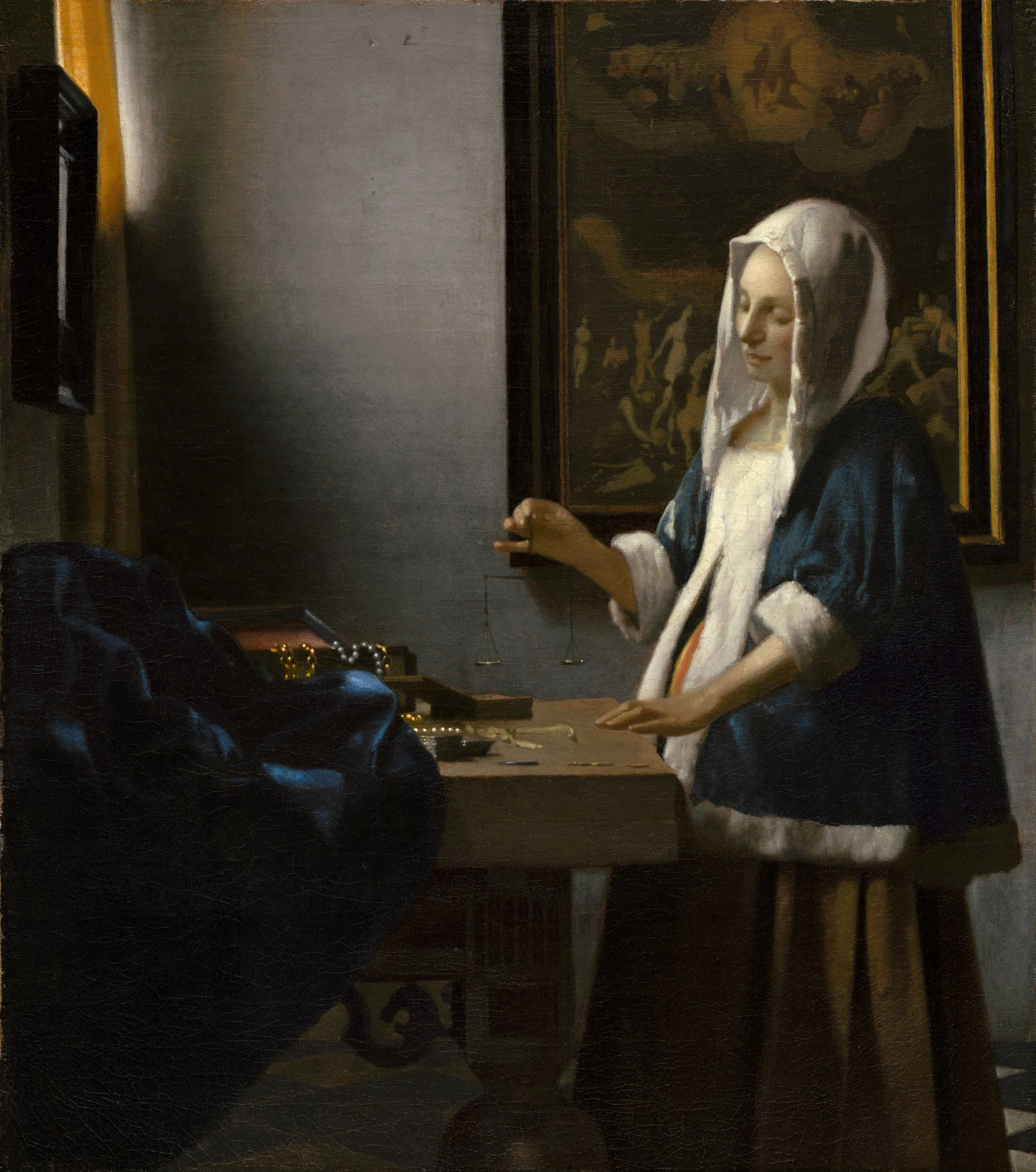 Woman Holding a Balance by Dutch painter and art dealer Johannes Vermeer. 1664 - Oil on Canvas