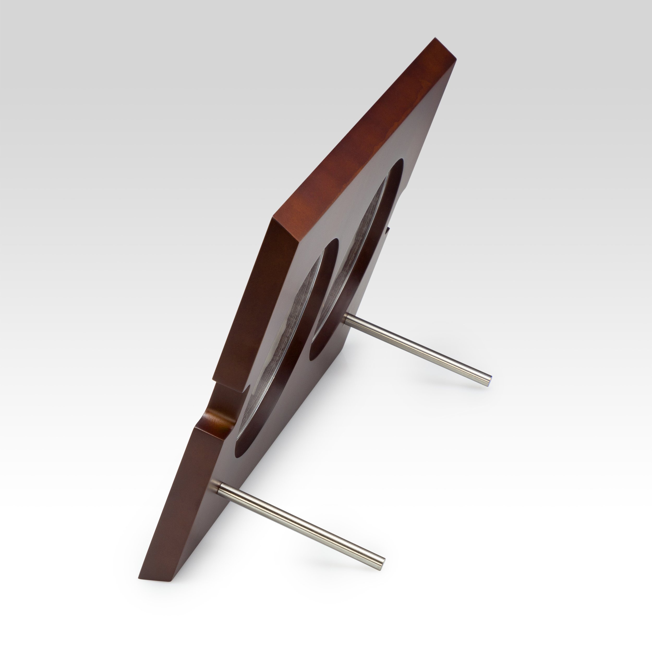 A wooden table with metal legs viewed from an angle.