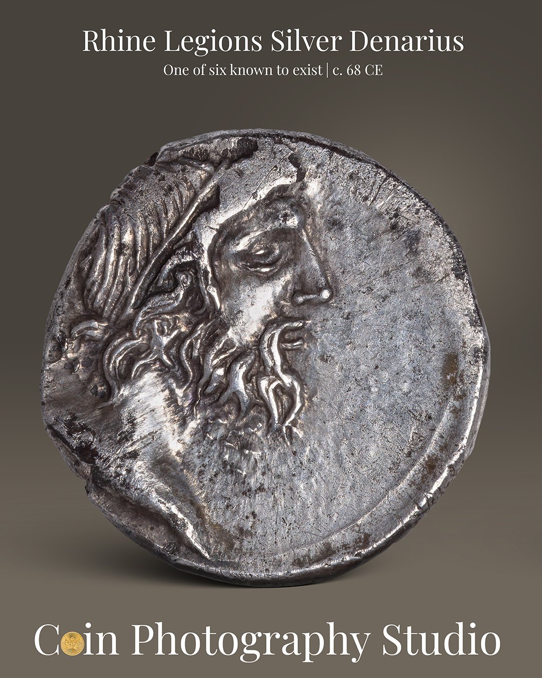 Ancient silver coin depicting a profile of a bearded man with a laurel wreath, labeled as Rhine Legions Silver Denarius from around 68 CE.