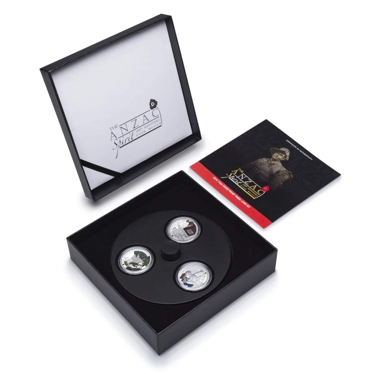 Set of three silver coins with designs inside a black presentation box, along with an informational booklet, celebrating The ANZA Spirit coin series for its 10th anniversary.