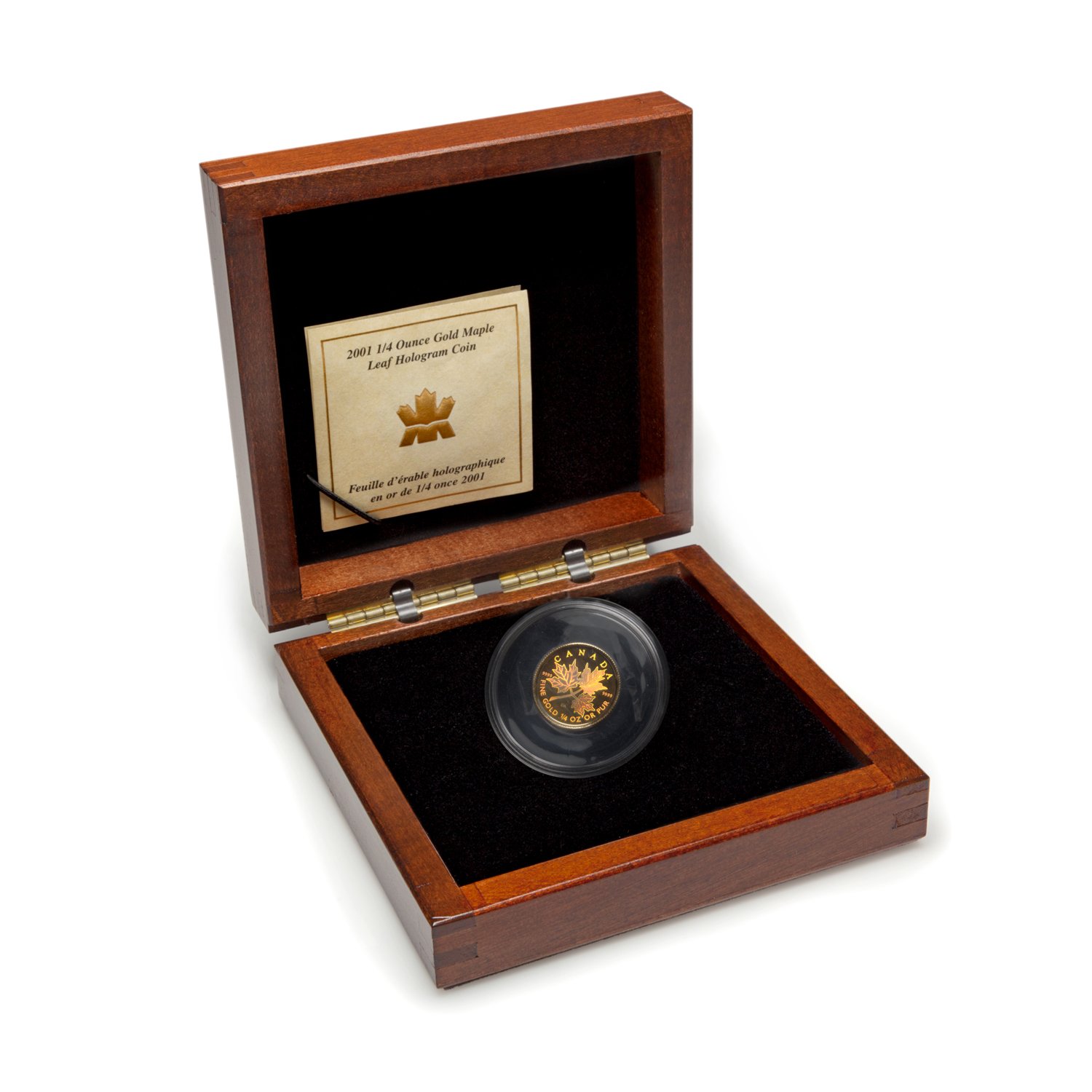 A 2001 1/4 ounce gold Maple Leaf hologram coin in a wooden display box with a certificate.