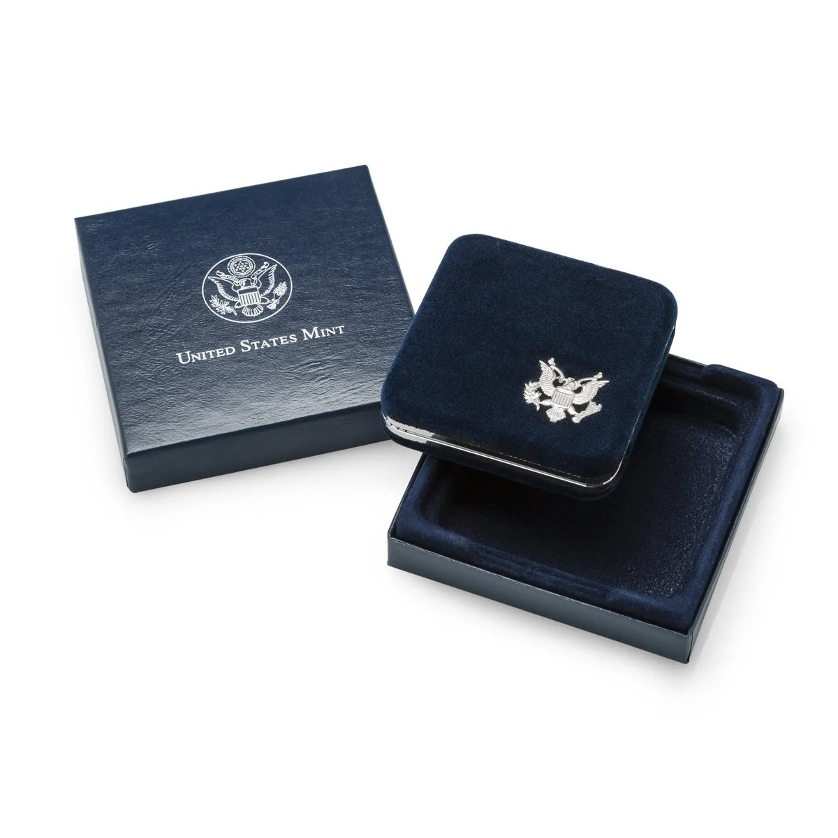A United States Mint keepsake box with a velvet exterior and a silver eagle emblem, alongside a matching velvet jewelry box, both set on a white background.