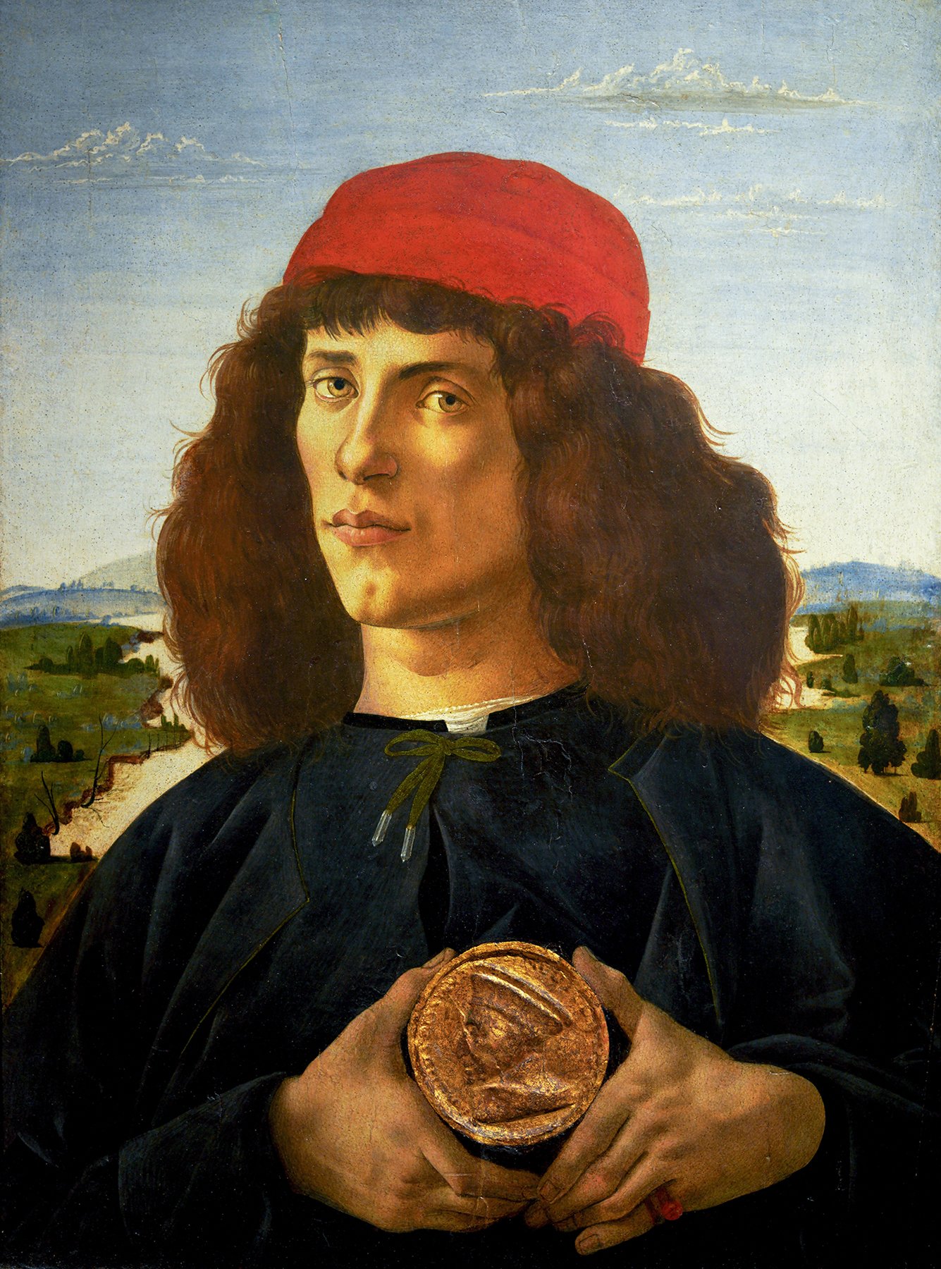 Portrait of a Man with a Medal of Cosimo the Elder, also known as Portrait of a Youth with a Medal, is a tempera painting by Italian Renaissance painter Sandro Botticelli. The painting features a young man displaying in triangled hands a medal stampe